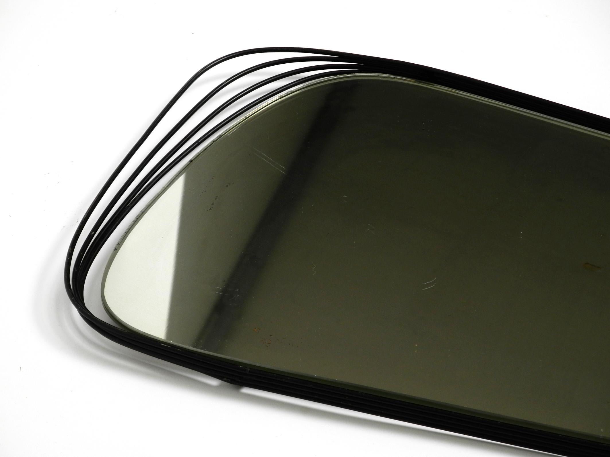 German Rare Heavy Mid-Century Modern Wall Mirror with a Black Abstract Metal Frame For Sale