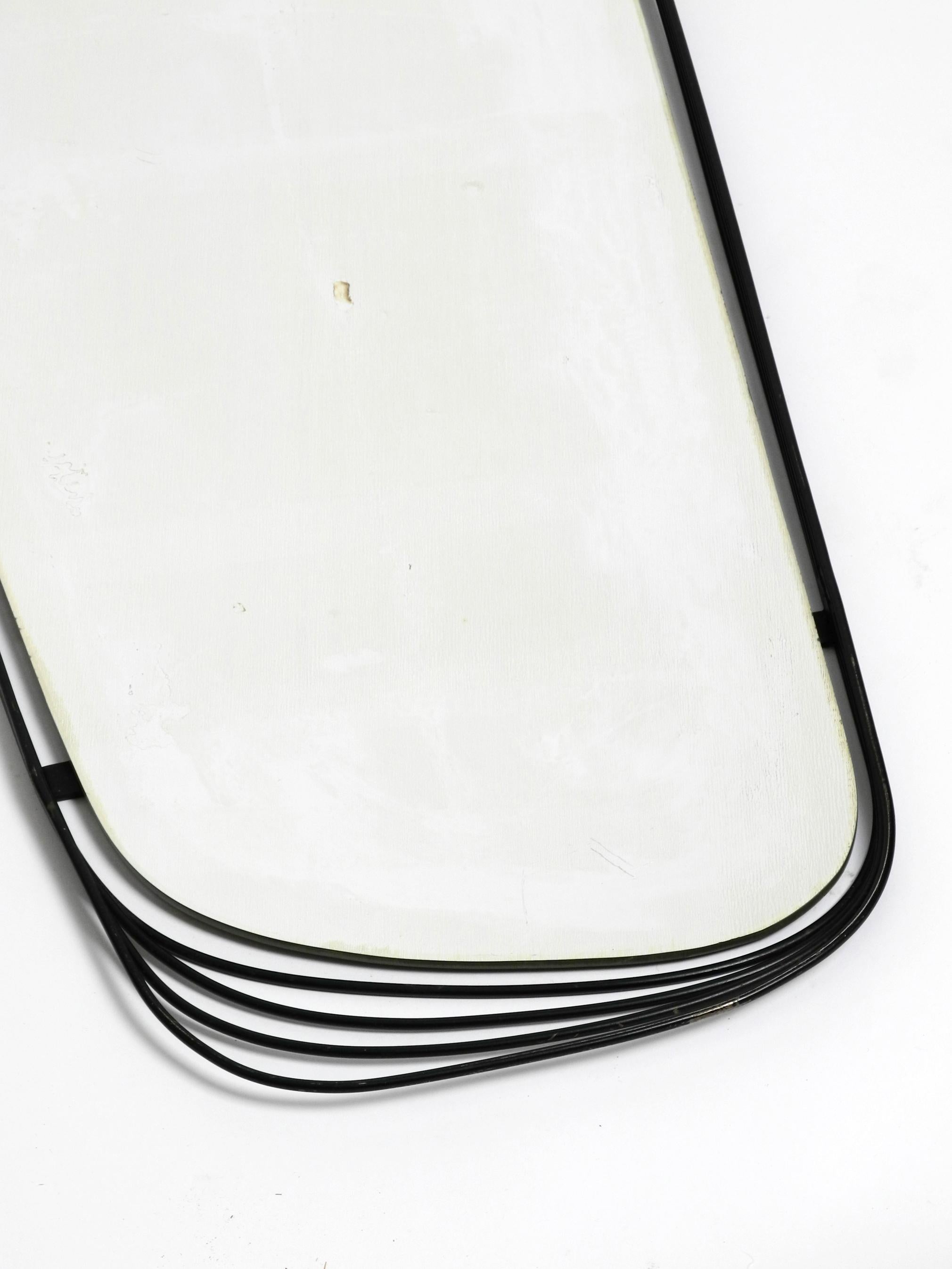 Mid-20th Century Rare Heavy Mid-Century Modern Wall Mirror with a Black Abstract Metal Frame For Sale