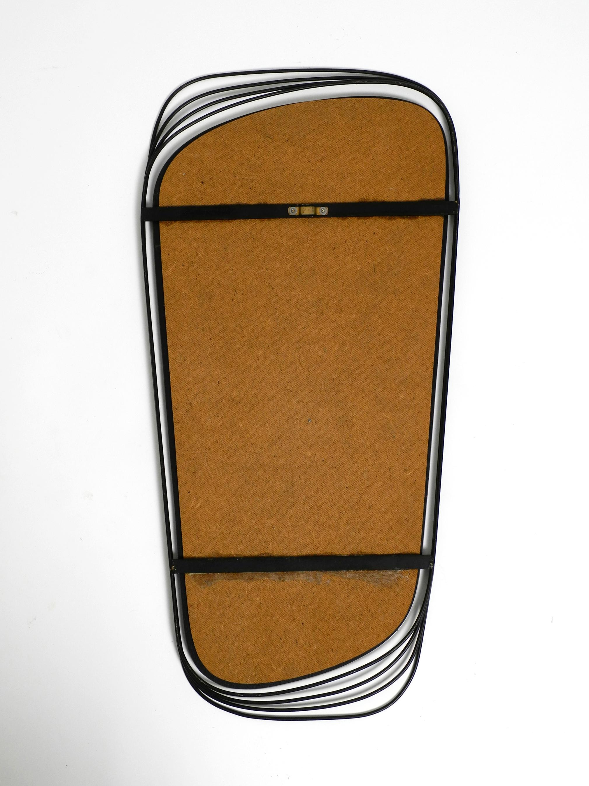 Rare Heavy Mid-Century Modern Wall Mirror with a Black Abstract Metal Frame For Sale 3