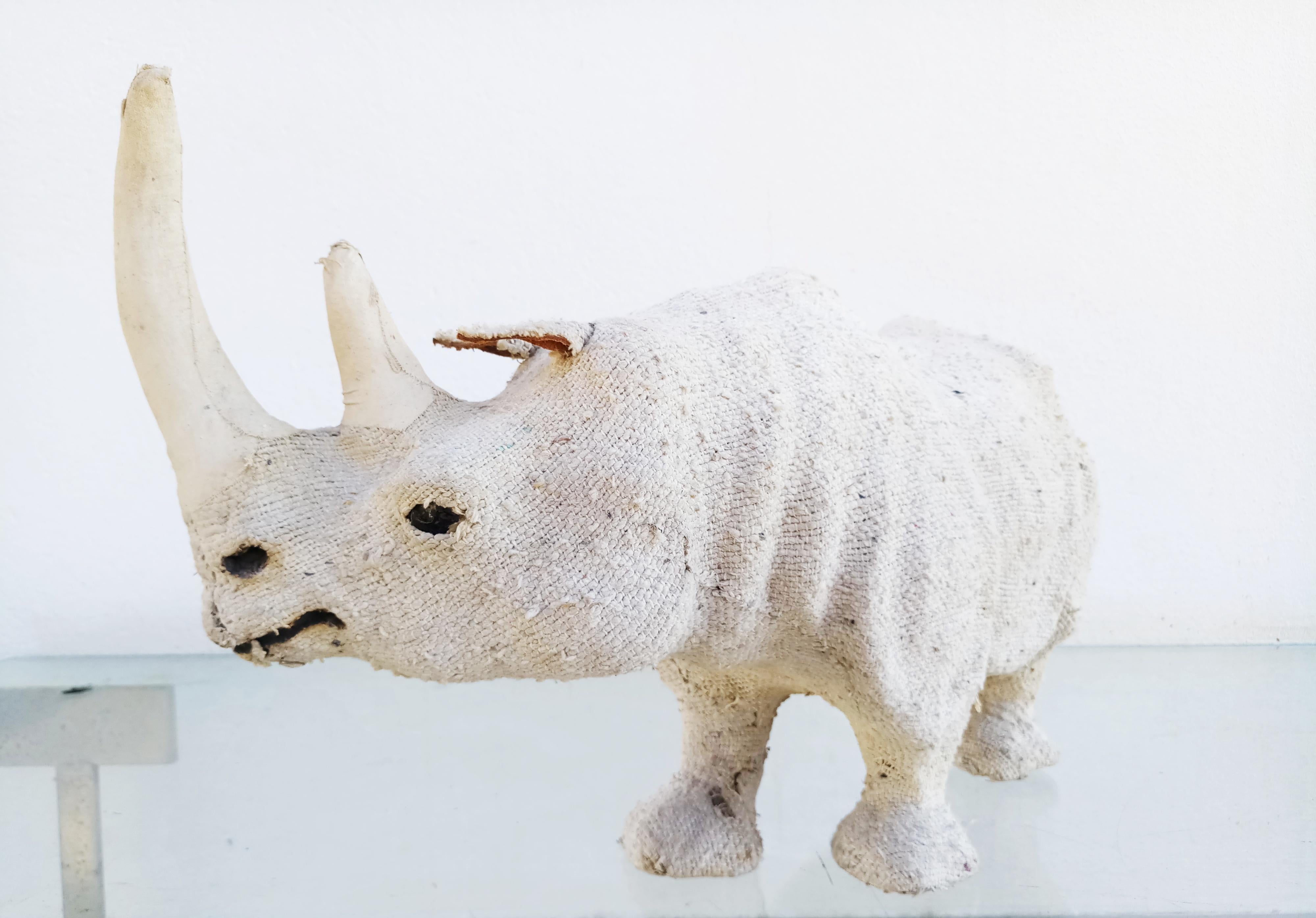 Beautiful and rare hemp fabric rhinoceros sculpture manufactured in 1950s. Glass eyes, with fine details.