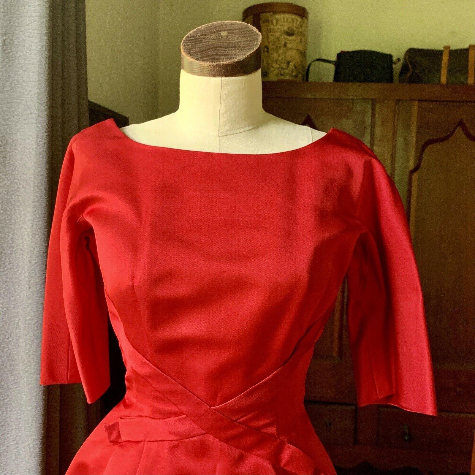 Herbert Sondheim, 1950's Era, Bias Tape Cross Bow Front, Round Neck, Pleated Front and Back, Back Zipper, Hook and Eye Black Closure, Label Intact, Gorgeous Red Satin, Built-in Red Crinoline with Hook and Eye Closures, Size XS/S

Additional Label: