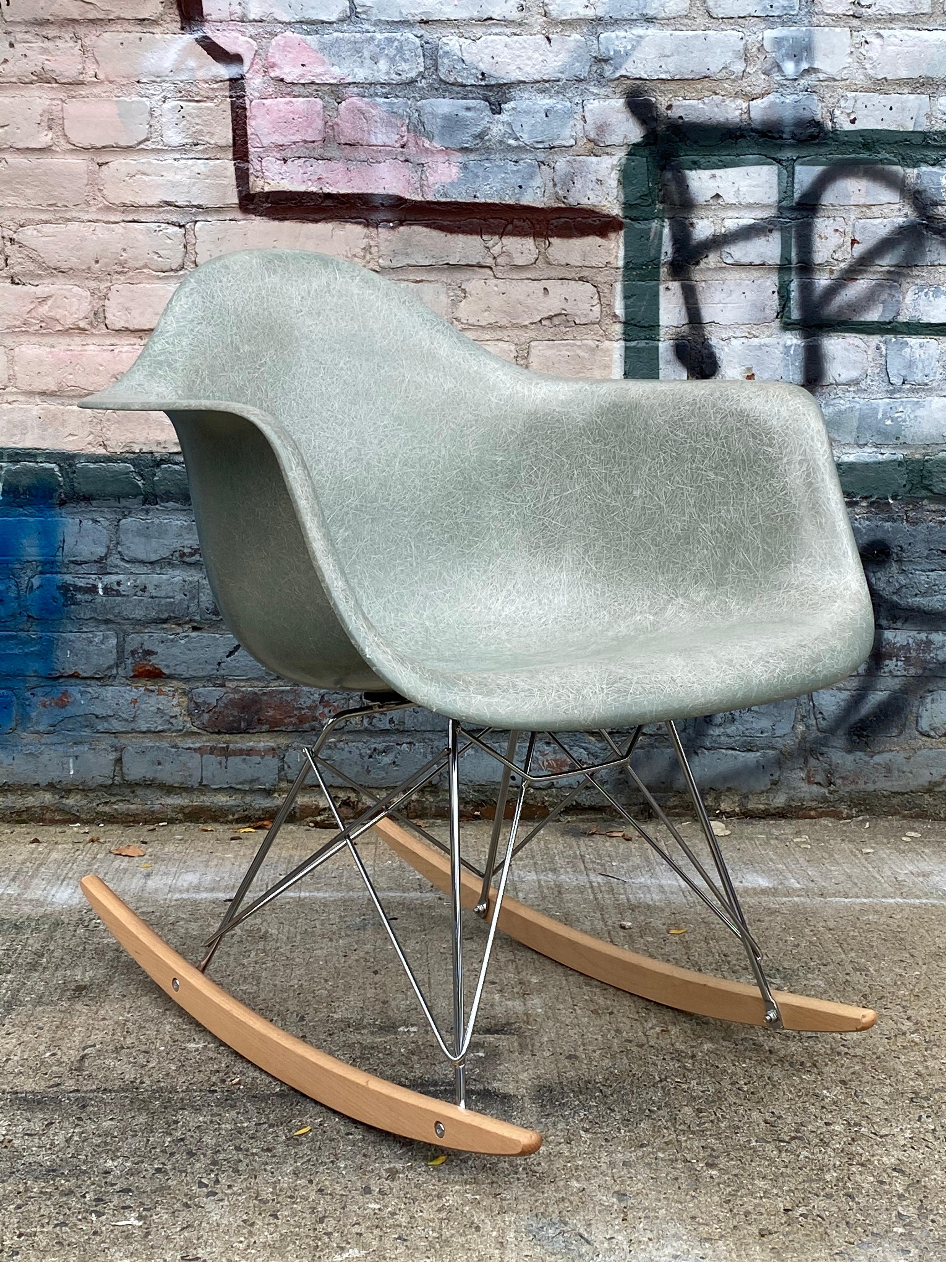 Very early shell, dating to mid-late 1960s production. Highly coveted and hard to find Seafoam green. On new rocker base, no cracks to the shell. Normal wear, retains Herman Miller label.