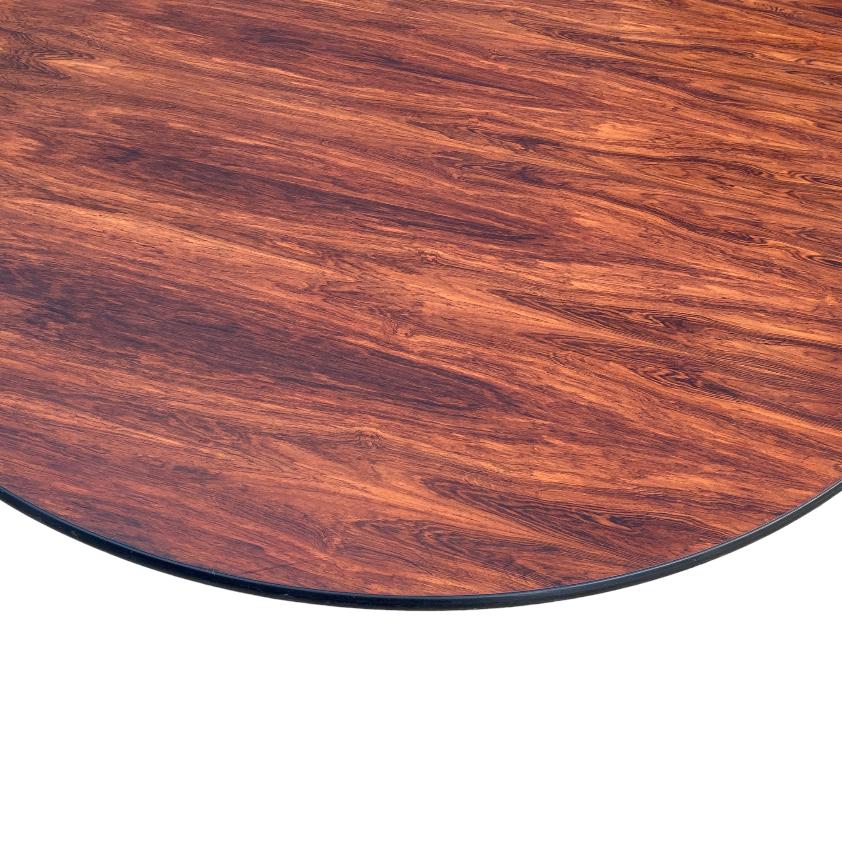 This is the biggest Eames rosewood table we have ever had. 60 inches in diameter, big enough for friends and family. Executed in stunning rosewood with bold coloring and vibrant figured grain pattern. Signed and guaranteed authentic. Tabletops