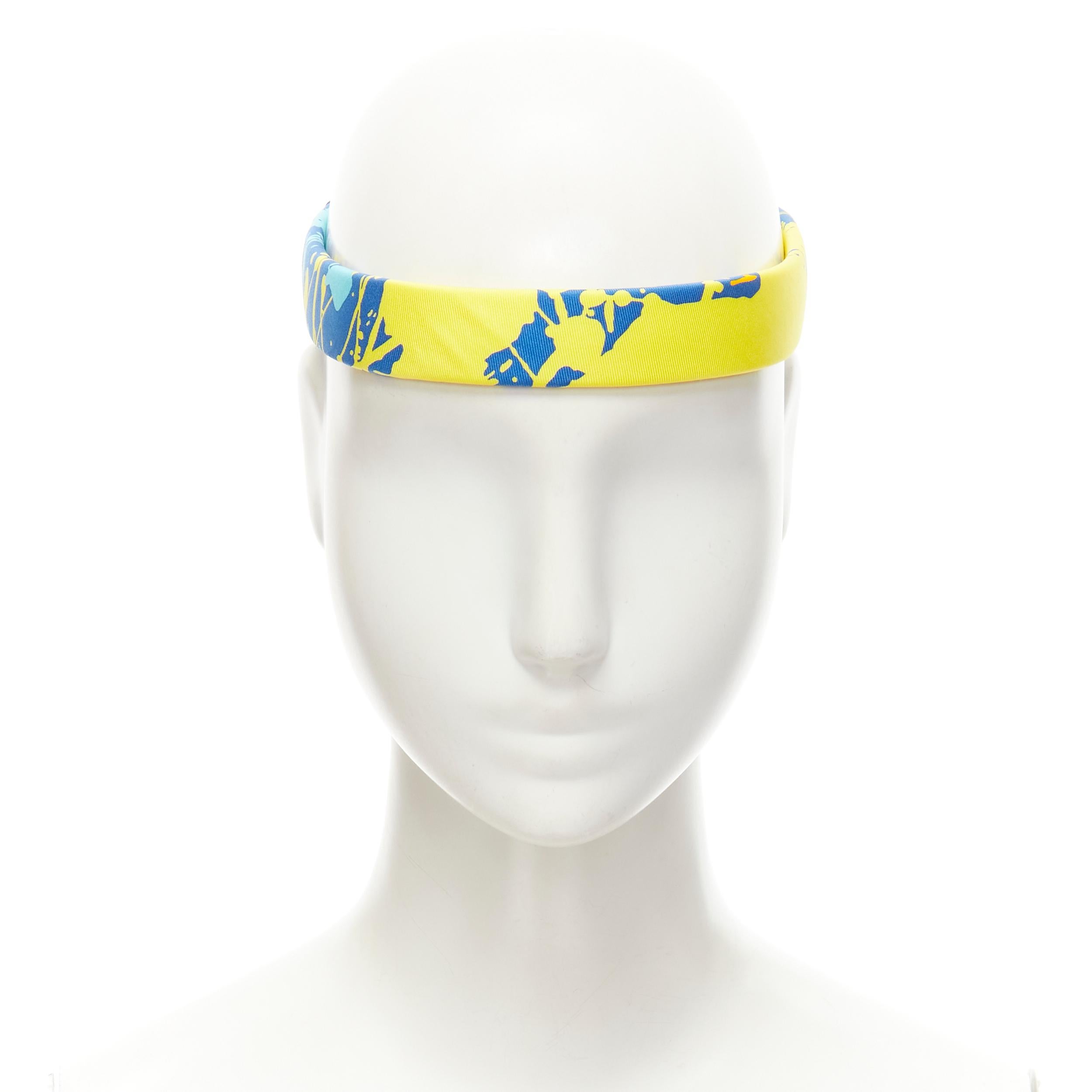 rare HERMES Bandeau Femme Mistinguette 100% silk blue yellow adjustable headband 
Reference: VACN/A00019 
Brand: Hermes 
Material: Silk 
Color: Blue 
Pattern: Abstract 
Closure: Adjustable 
Extra Detail: Adjustable to fit all sizes. 
Estimated