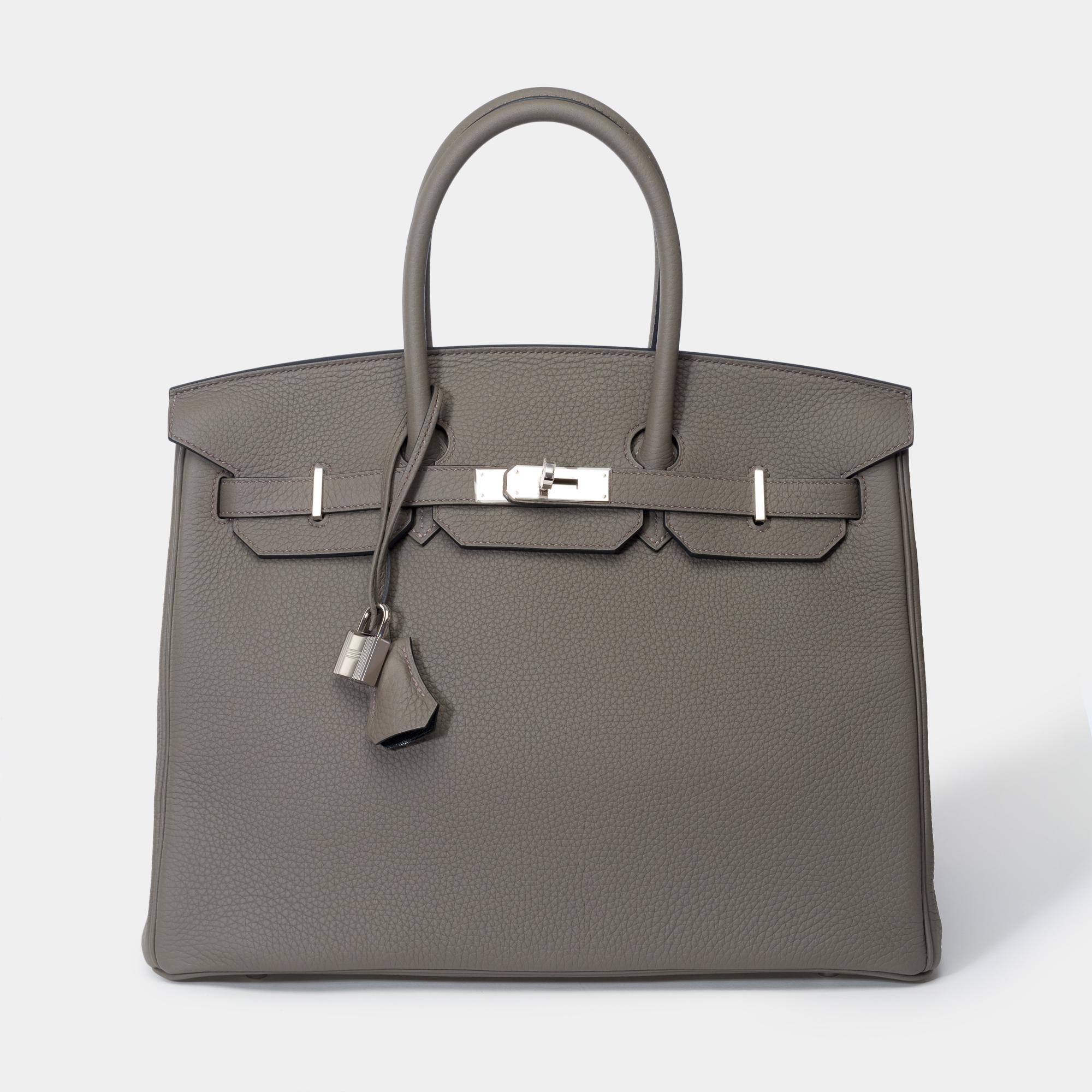 Exceptional & Rare Hermes Birkin 35 Special Order (HSO) in Etain Togo leather and black interior, palladium silver metal trim, double grey leather handle for hand carry

Flap closure
Black leather lining, zip pocket, patch pocket
Signature: 