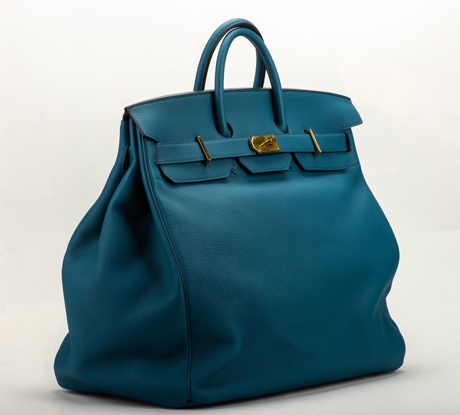 Hermes icon 1892 creation. Original bag to carry the horse saddle. Blue cobalt clemence leather with gold hardware. Date stamp R for 2014. Handle drop 4