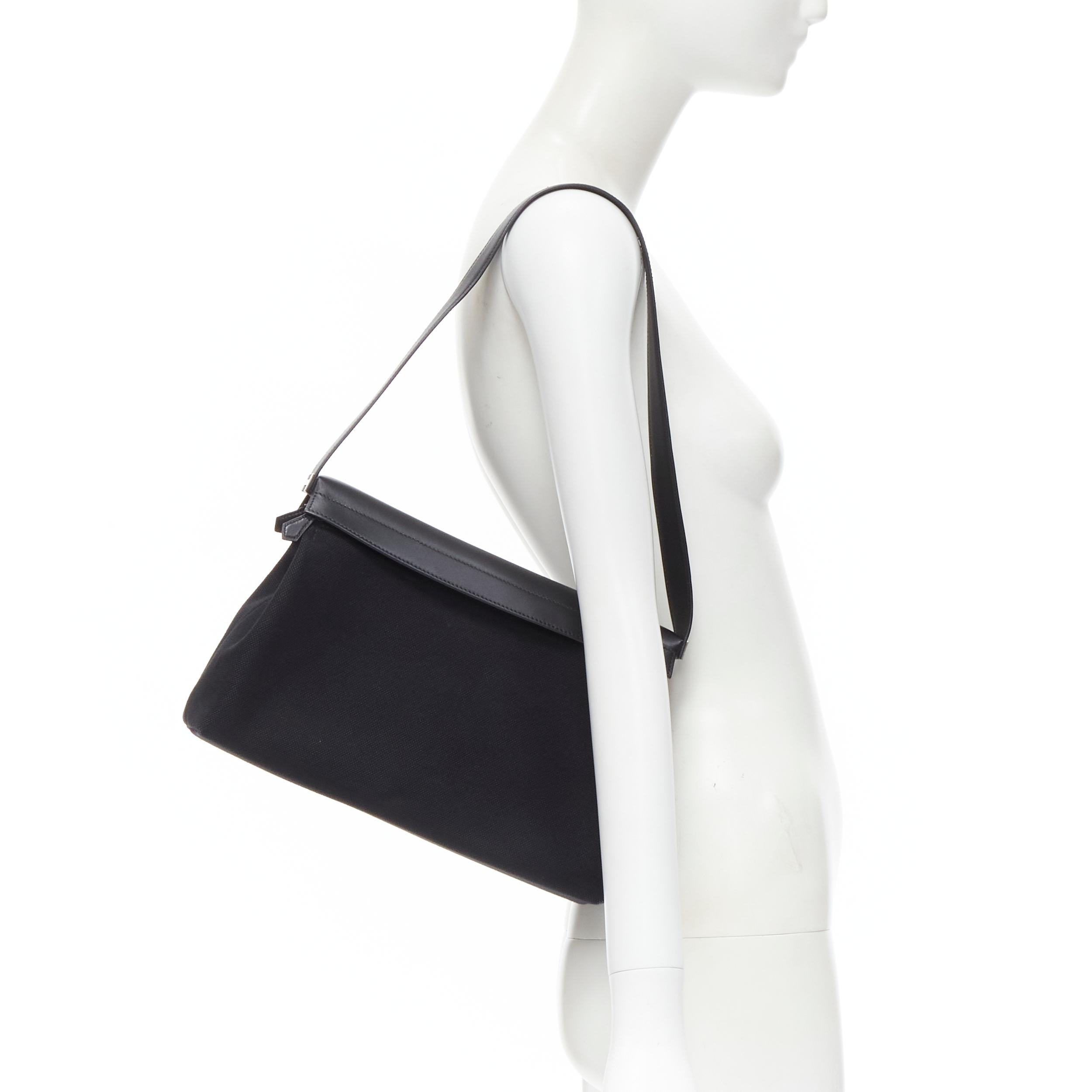 rare HERMES black canvas silver leather 2-in-1 convertible shoulder bag 
Reference: TGAS/B01638 
Brand: Hermes 
Model: Convertible 2 in 1 shoulder bag 
Material: Leather 
Color: Black 
Pattern: Solid 
Closure: Zip 
Extra Detail: 2-in-1 convertible