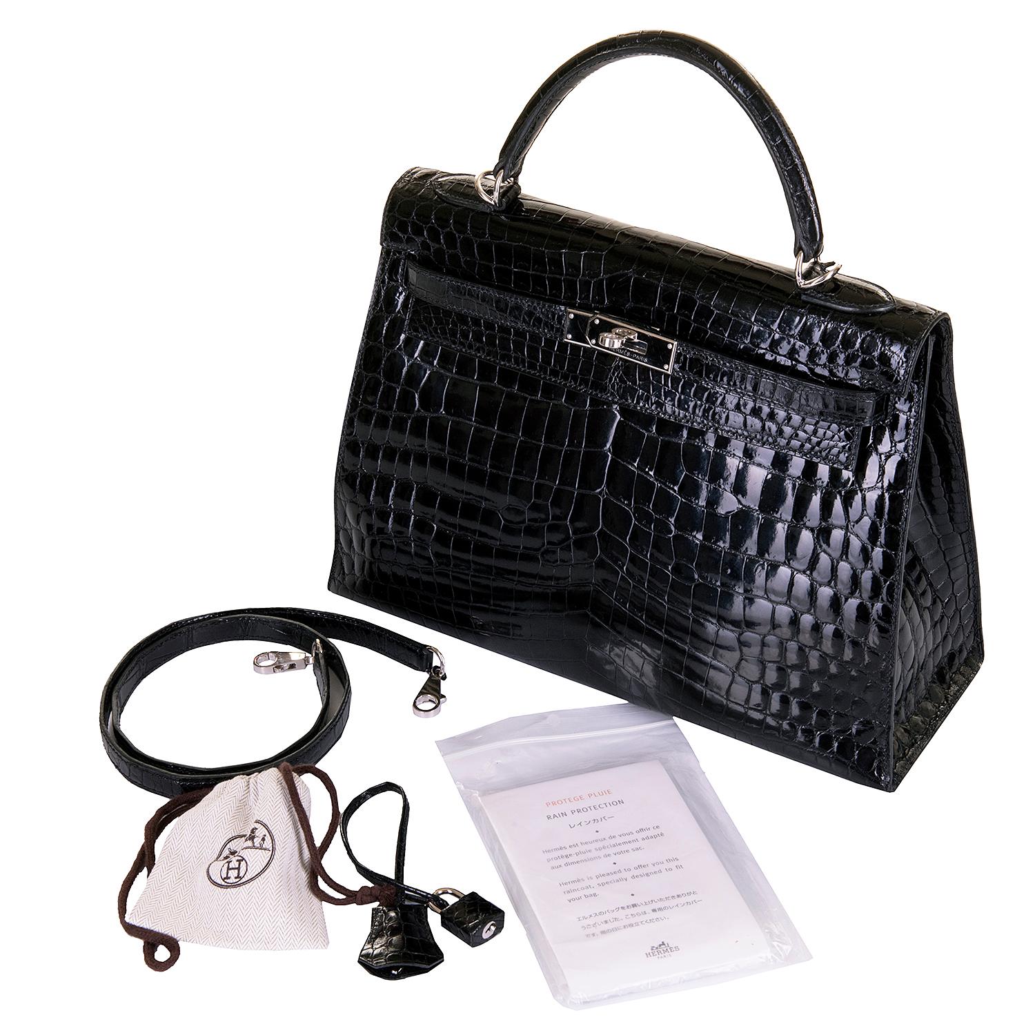 This beautiful Kelly 'Sellier' 32cm Bag is finished in Shiny Black Crocodile accented with Silver Palladium hardware. This much sought-after rare bag comes complete with it's detachable crocodile shoulder strap and matching padlock, key-fob and two