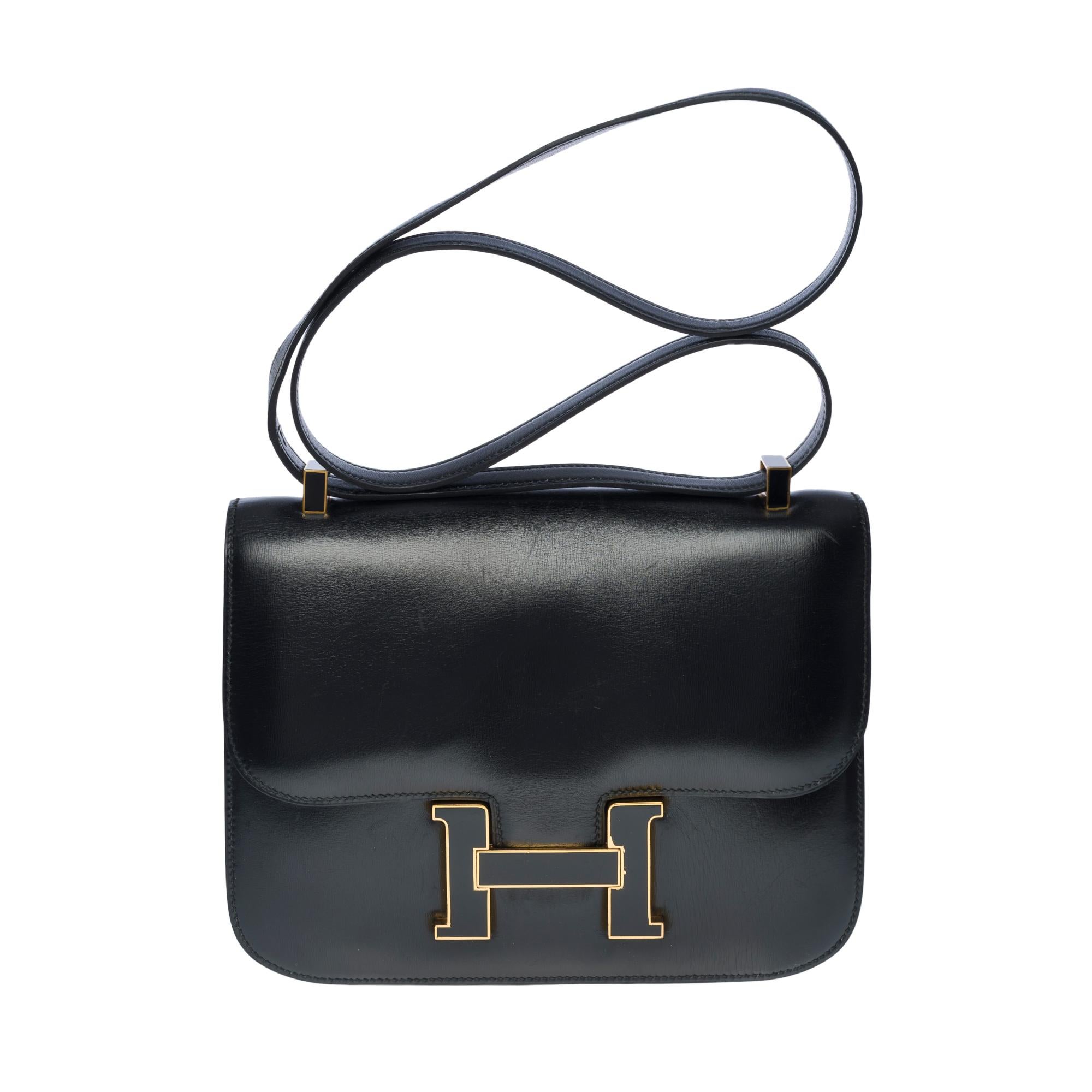 Rare & Amazing Hermes Constance 23 limited edition in black box calf leather , gold-plated and enamel metal hardware, convertible handle in black leather for a hand, shoulder or crossbody carry

Closure marked H on flap
A patch pocket on the back of