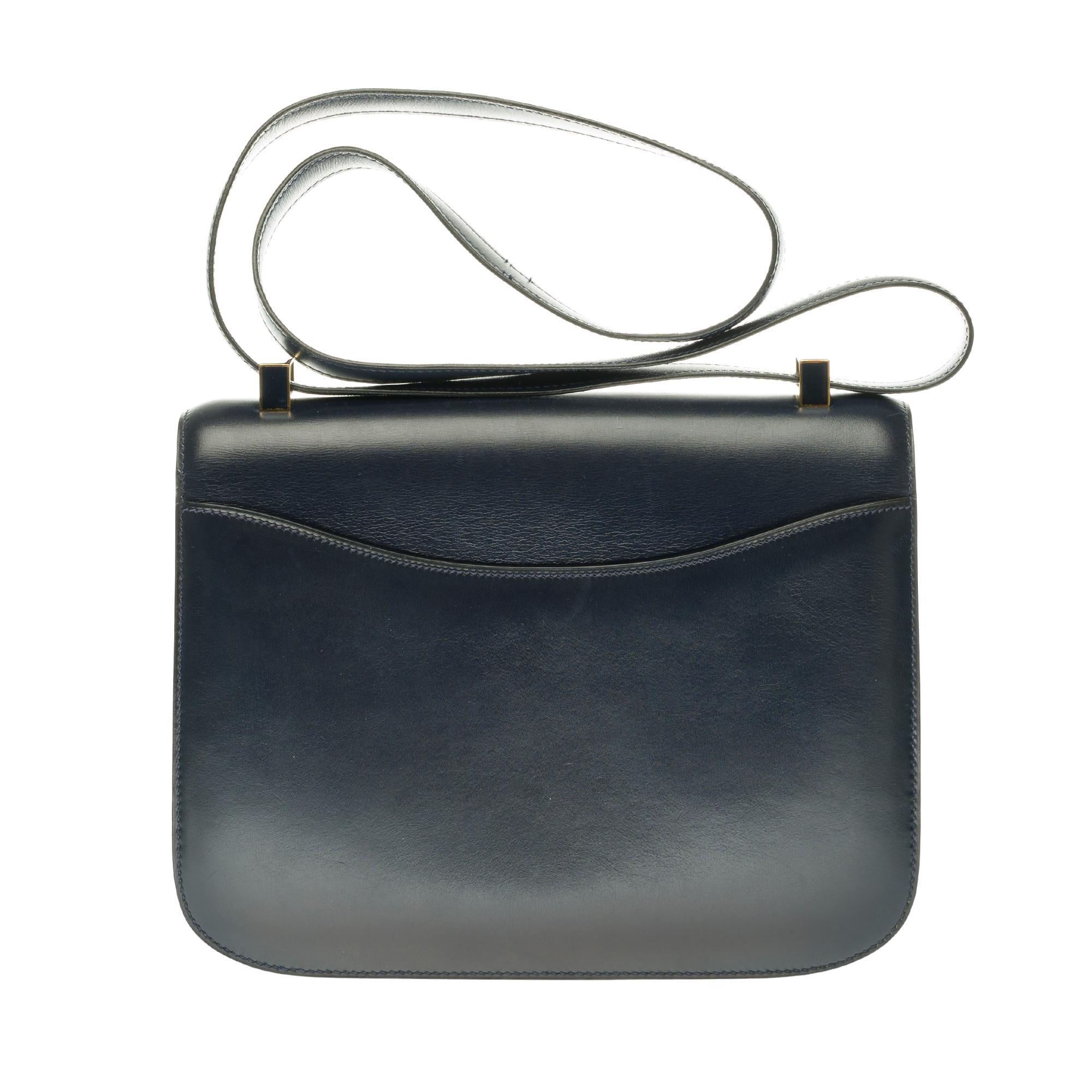 Splendid & Rare Hermes Constance 23 cm handbag in navy blue box, gold metal hardware and enamel , transformable handle in navy leather allowing a hand or shoulder support.

Closure with H buckle in marine enamel (limited edition) on flap.
A patch