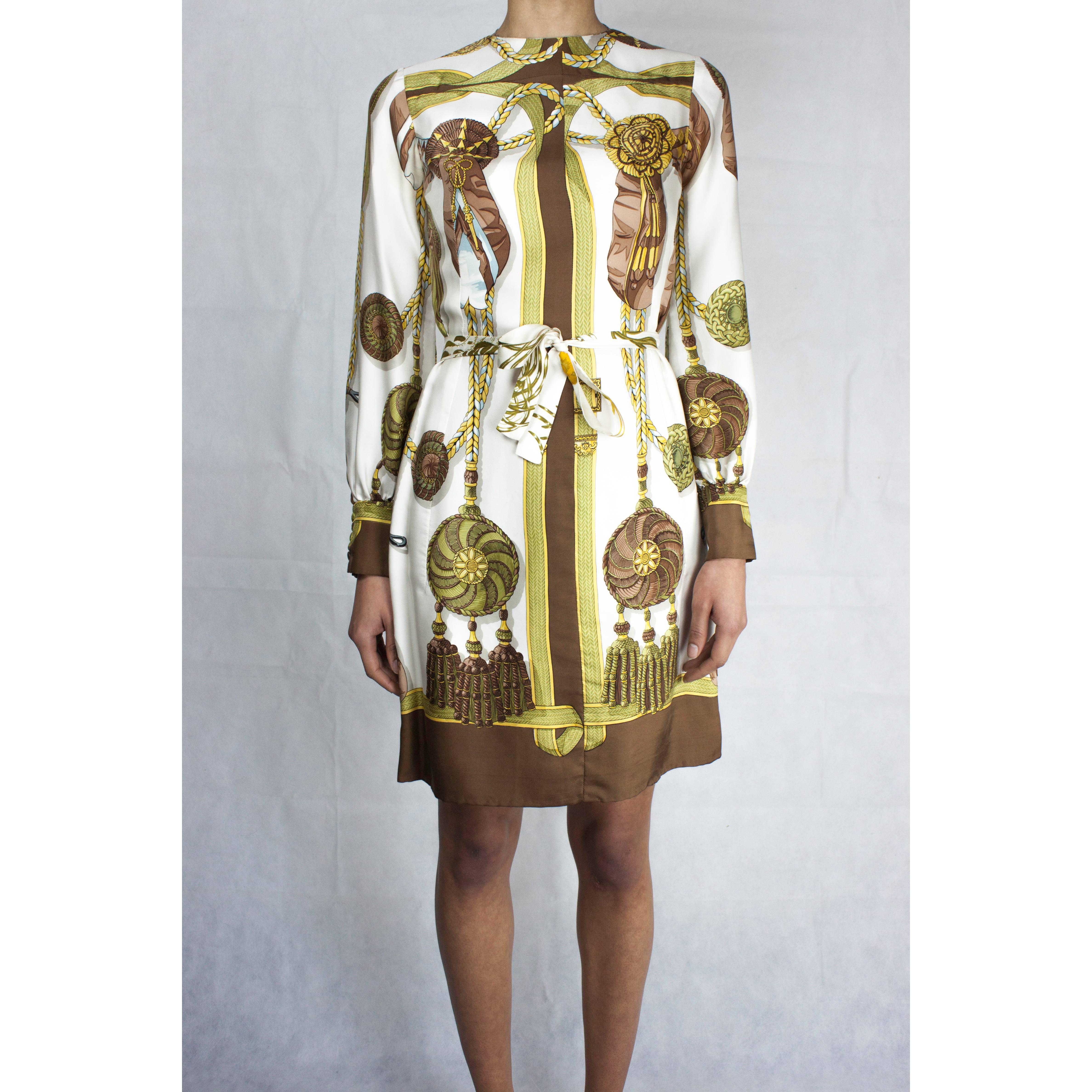 Since 1937, Hermès has called upon artists to create art on silk for their scarves, shirts and other signature pieces.

The print for this elegant dress was conceived by the French artist Cathy Latham.

For over forty-five years Latham has designed