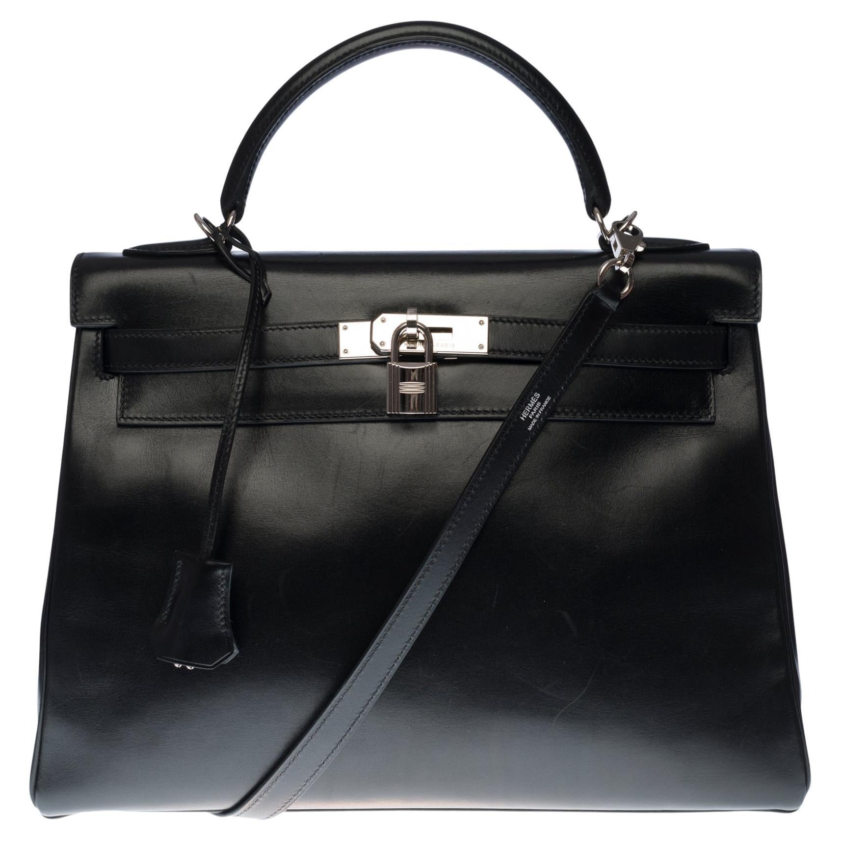 Rare Hermès Kelly 32 retourné handbag with strap in black calf leather, SHW