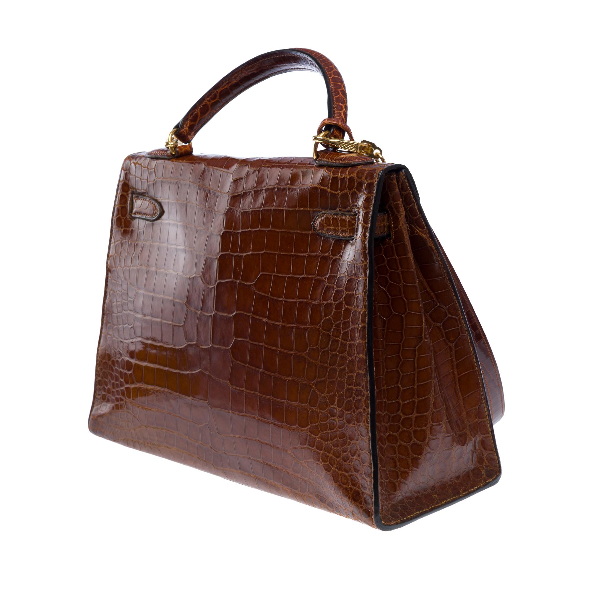 Women's Rare Hermès Kelly 32 saddle handbag strap in Cognac Crocodilylus leather , GHW