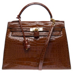 Rare Hermès Kelly 32 saddle handbag strap in Cognac Crocodilylus leather , GHW