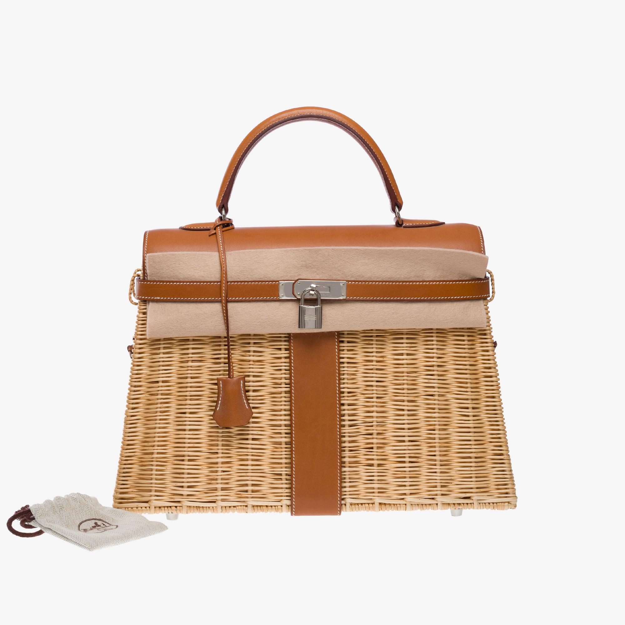 Fantastic​ ​&​ ​Rare​ ​Hermes​ ​Kelly​ ​35​​ ​Picnic​ ​in​ ​wicker​ ​and​ ​Barenia​ ​leather​ ​with​ ​white​ ​stitching,​ ​palladium​ ​silver​ ​metal​ ​hardware,​ ​brown​ ​Barenia​ ​leather​ ​handle​ ​allowing​ ​a​ ​hand​ ​carry

Flap​