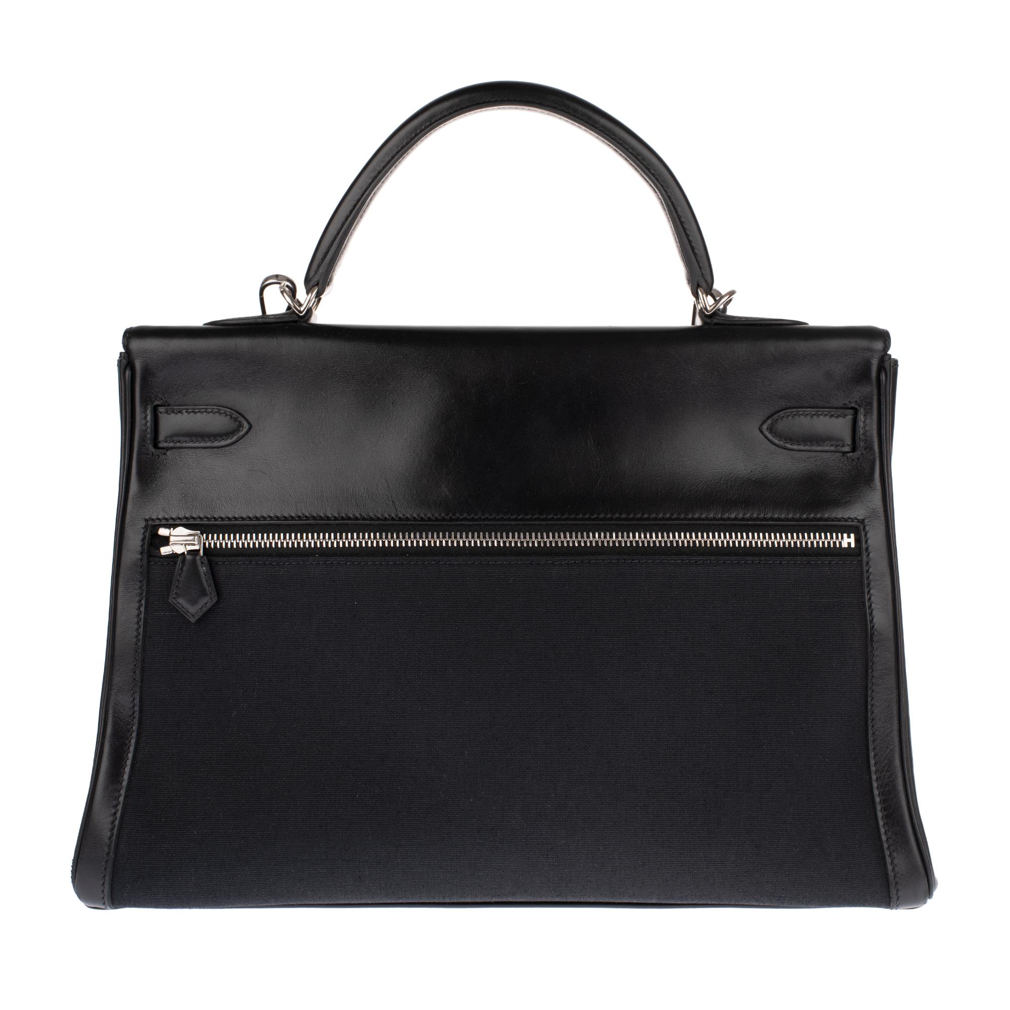 Stunning and rare ( Sold out, no longer produced by Hermès) Hermes Kelly Lakis handbag 35 cm in black leather and canvas H , palladium metal trim, simple handle in black leather , a removable leather and black canvas shoulder strap (not signed