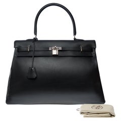Rare Hermès Kelly Relax 50 retourne Week-end bag inBlack Swift leather, SHW