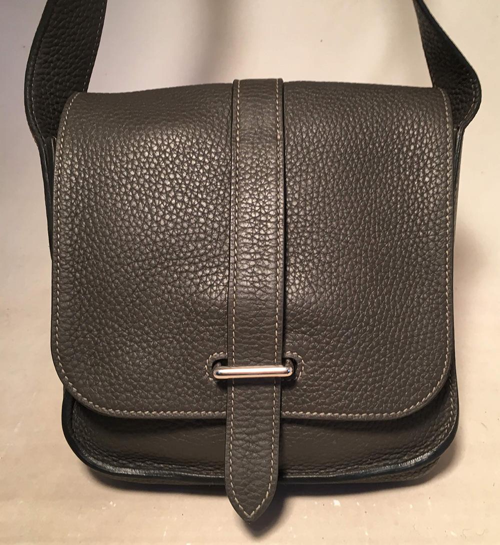 RARE Hermes Mini Grey Clemence Steve Caporal Crossbody Messenger Shoulder Bag in very good condition. Grey clemence leather exterior trimmed with silver paladium hardware and an adjustable long leather shoulder strap that can be worn as a cross body