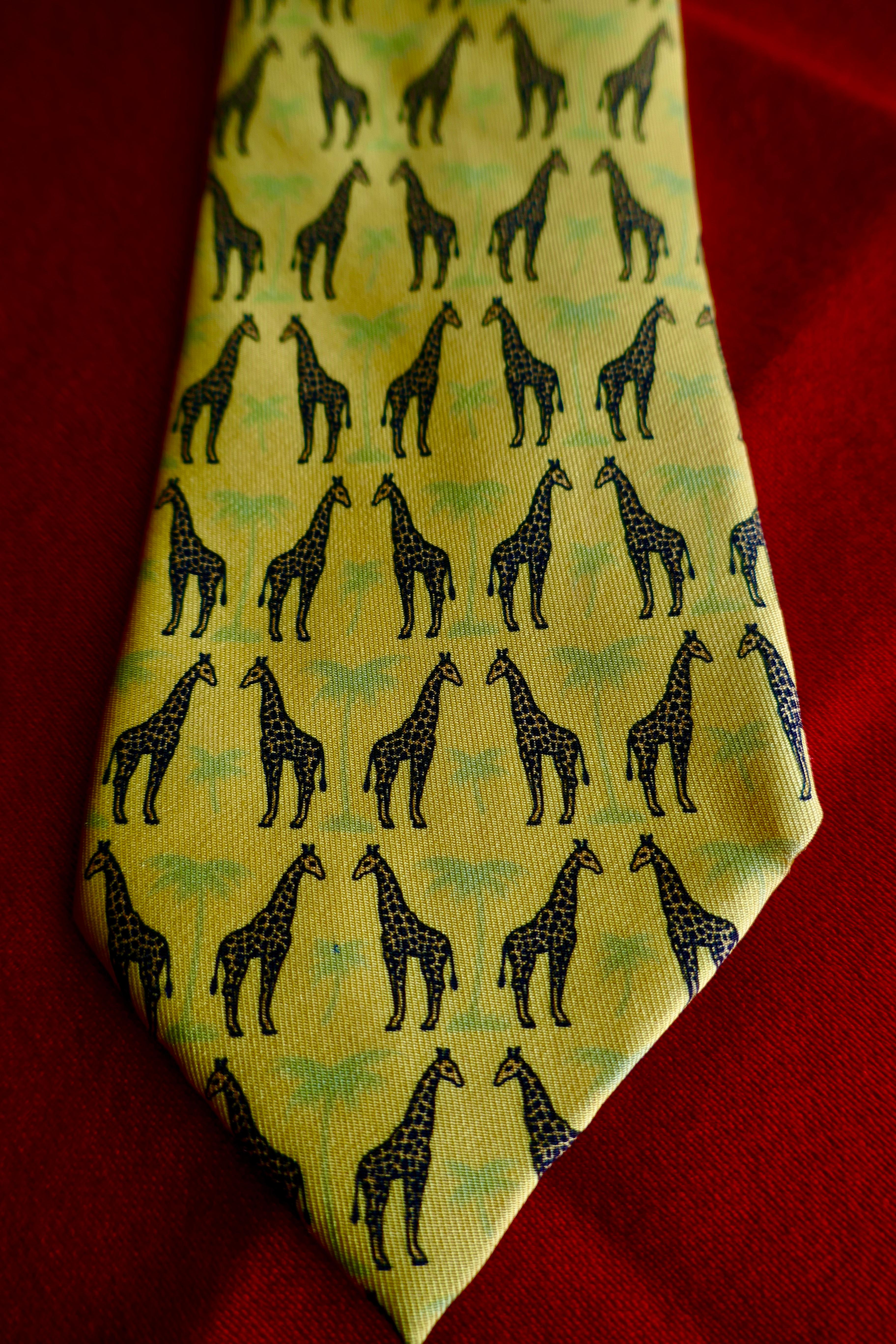 Rare Hermes Novelty Silk Tie, Giraffe Face Off, Hermes Sunflower Pallet 

Classic Hermes All Over Animal design, Giraffes 
Wonderfull Sunflower Yellow Pallet 
A Very Special tie, instantly recognisable as Hermes by those in the know
100% silk 
Silk