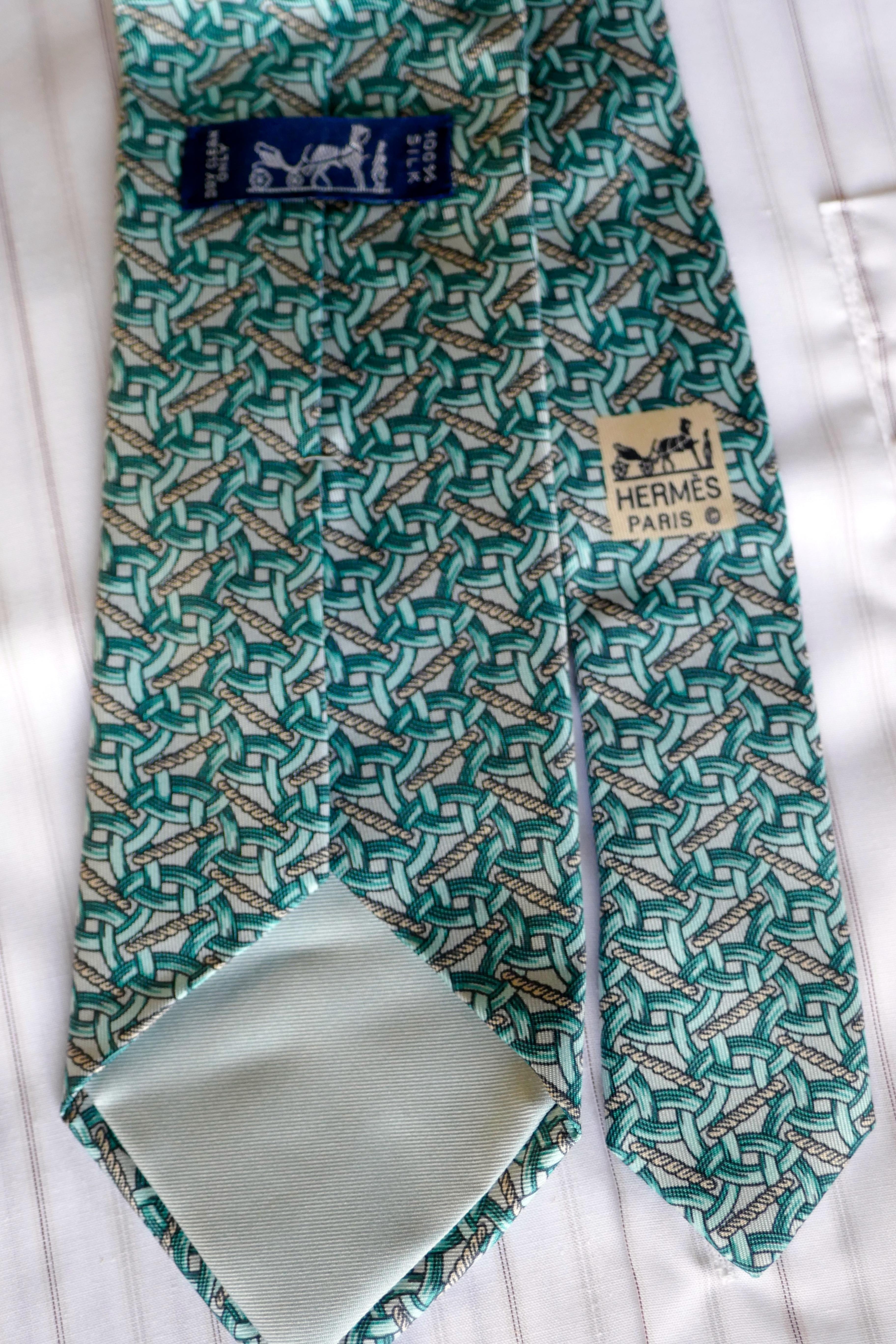 Rare Hermes Silk Tie, All Over Link Pattern, Aqua On Silver/Grey

Classic Hermes All Over Chain Design
Very Rare Colour-way Aqua on Silver Grey
A Very Special tie, instantly recognisable as Hermes by this e in the know
100% silk 
Silk Lined in