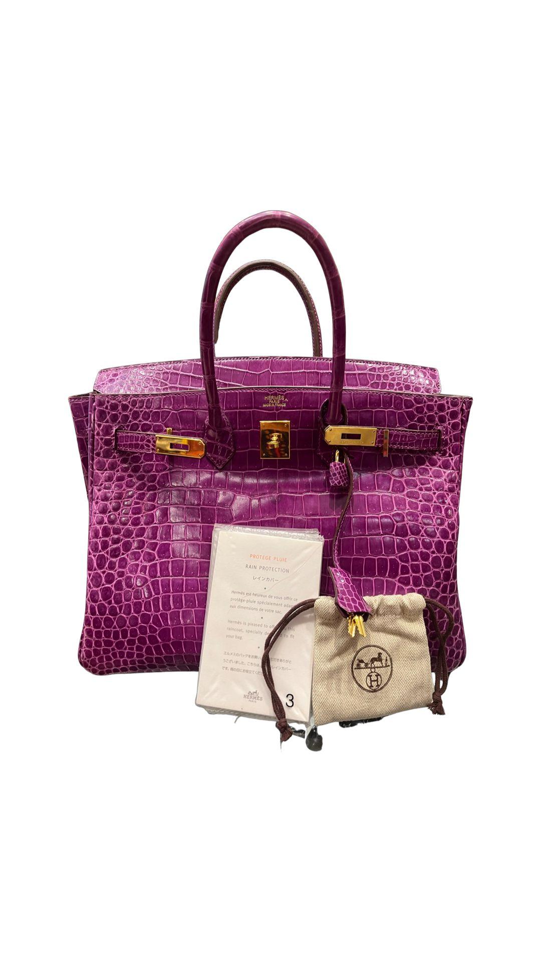 Hermes Violet Porosus Crocodile Birkin 35 Bag. 
Rare exotic crocodile bag with gold hardware. Excellent condition. Like new. Interior is clean. all corners in excellent condition. Porosus crocodile is one of the most expensive exotics by Hermes.