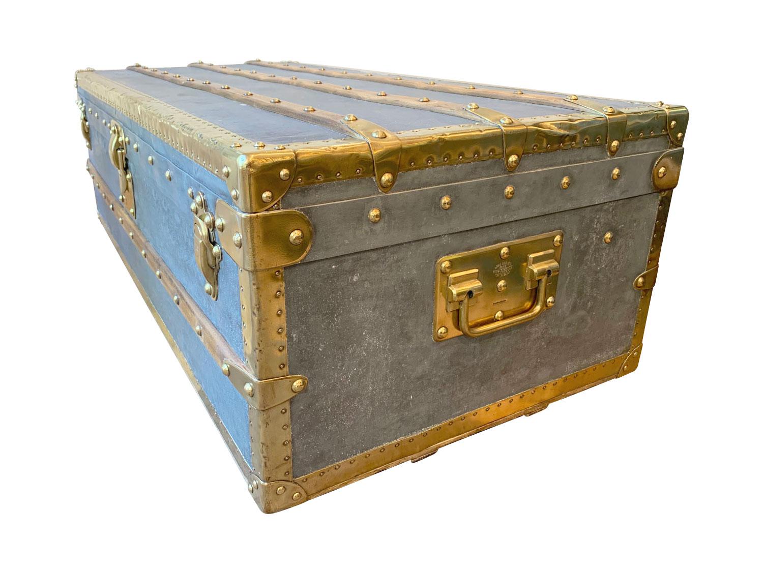 Hermetically sealed zinc Louis Vuitton Cabin Trunk, circa 1885. This extremely rare and highly sought-after all-zinc covered small Malle Cabine (Cabin Trunk) with an all brass trim, LV brass studs, copper pins, brass side handles and locks, with two