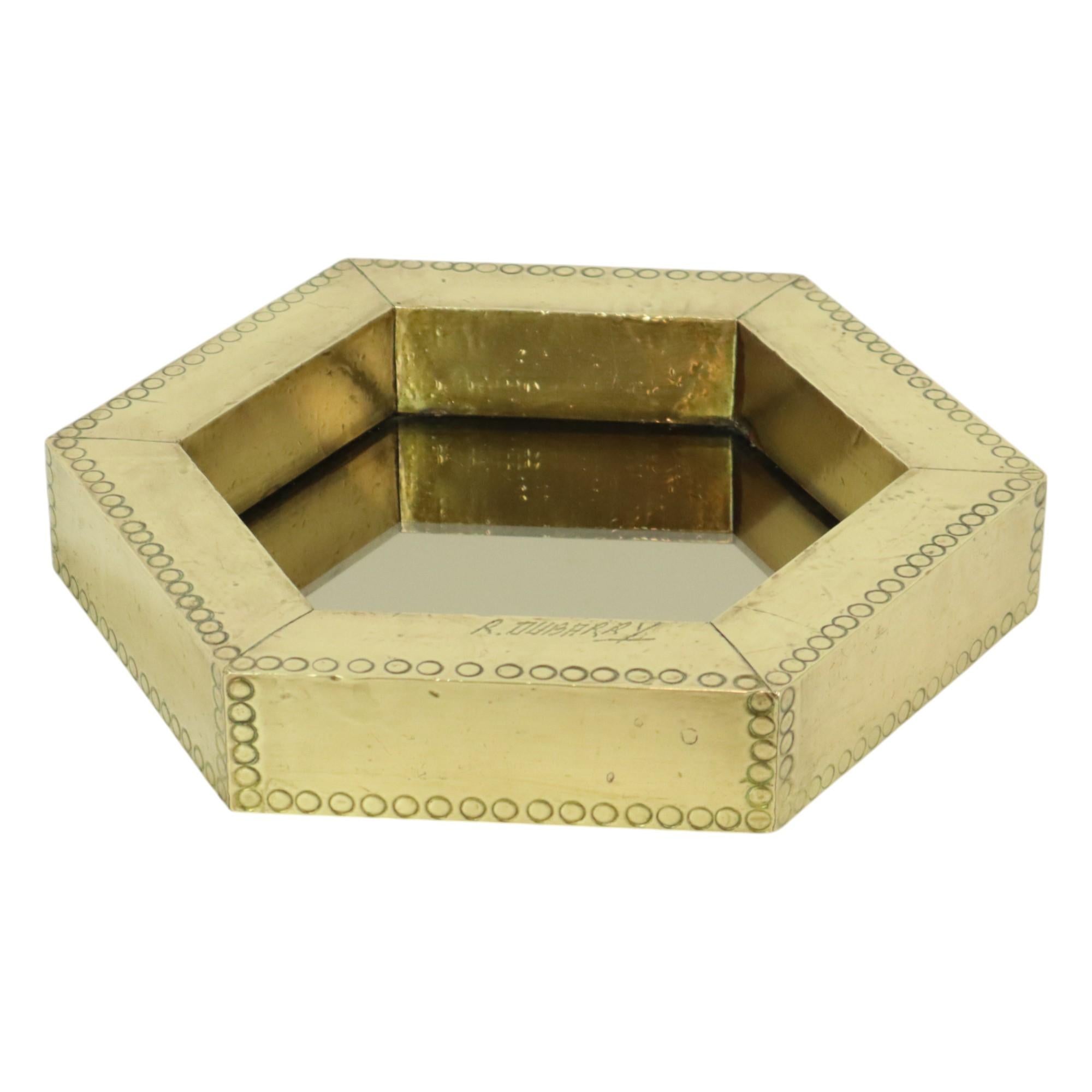 Rare hexagonal design mirror made of wood, hammered brass, and smoked mirror glass, by Argentinian top designer Rodolfo Dubarry in the 1970s, Spain.

In 1967, Rodolfo Dubarry moved from his home country Argentina to Marbella Spain, where he worked