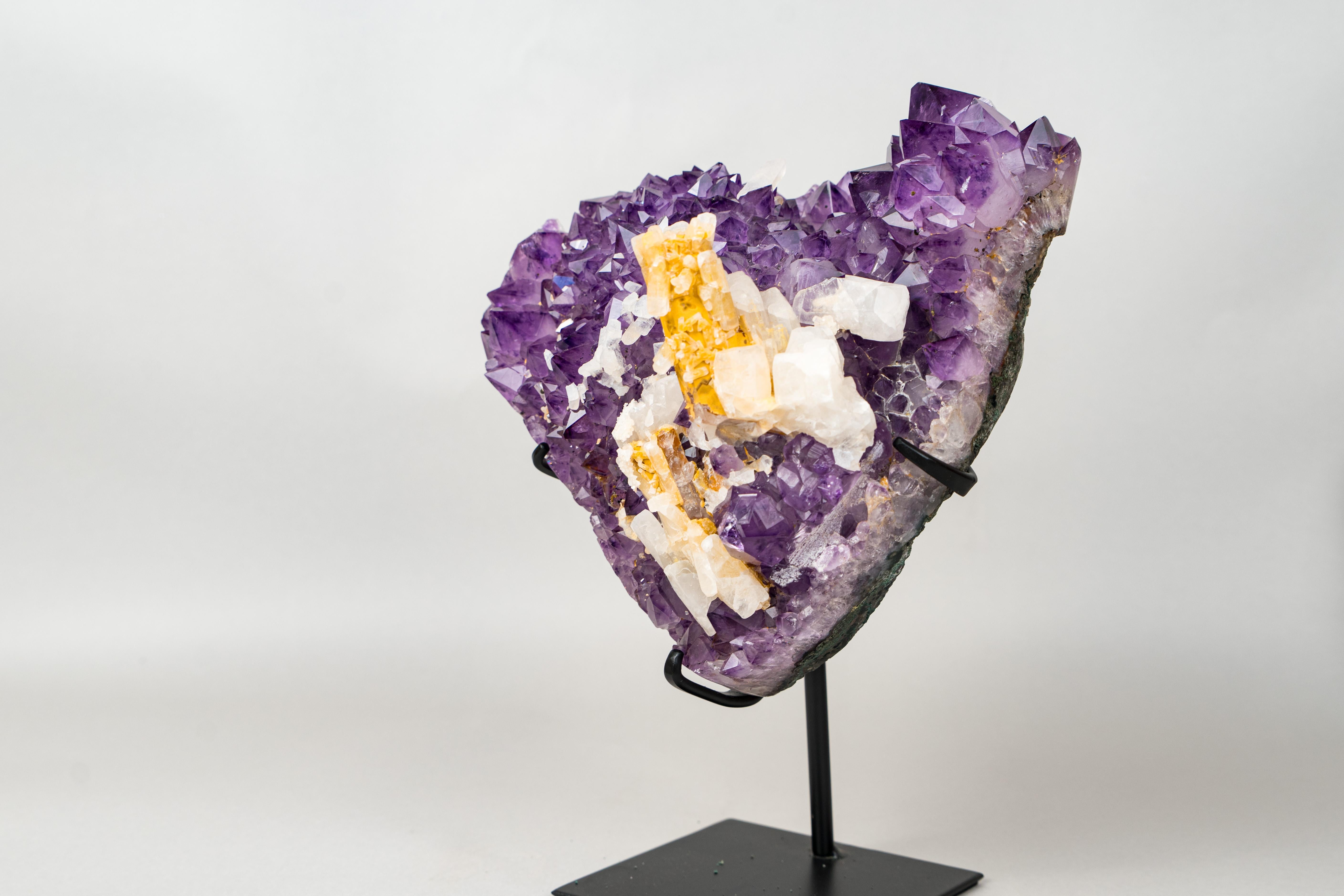A One-of-a-Kind Hexagonal Yellow Calcite on a Gemmy, Sparkly Amethyst

▫️ Description

Calcite specimens from Brazil are a collector’s favorite — and finding one with a hexagonal formation and a vivid yellow coating contrasting beautifully against