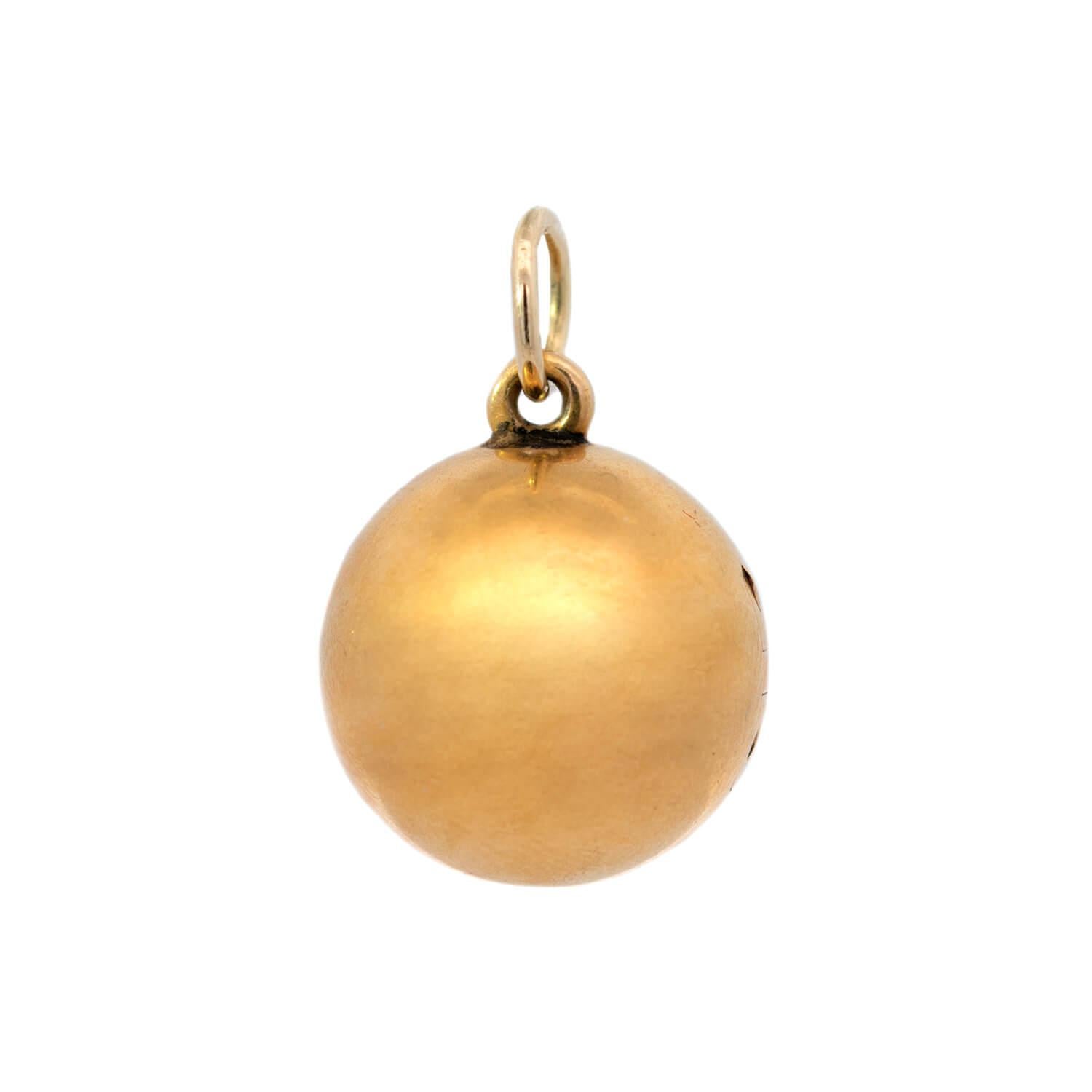 A fabulous hidden key ball pendant from the Victorian (ca1880) era! This stylish piece is made of vibrant 18kt yellow gold and has a three-dimensional spherical shape. The outside of the ball is a smooth surface and is hollow inside. The ball opens