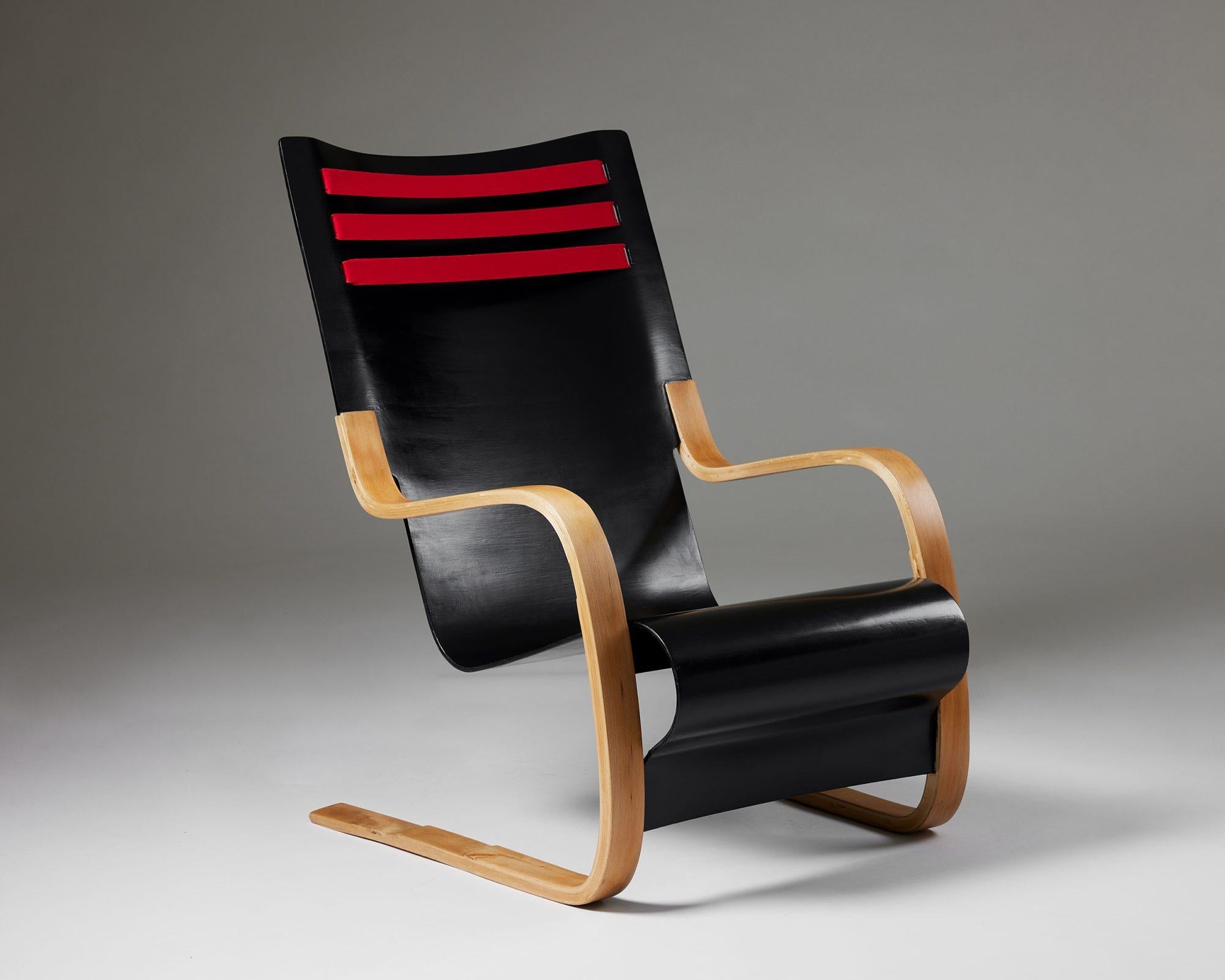 Rare high-back chair model 402 designed by Alvar Aalto for OY Huonekalu-ja Rakennustyötehdas AB, 
Finland, 1930s.

Bent plywood, beech, and textile ribbons. 

This is one of the first versions of model 402 produced.

Measures: H: 92.5 cm / 3'