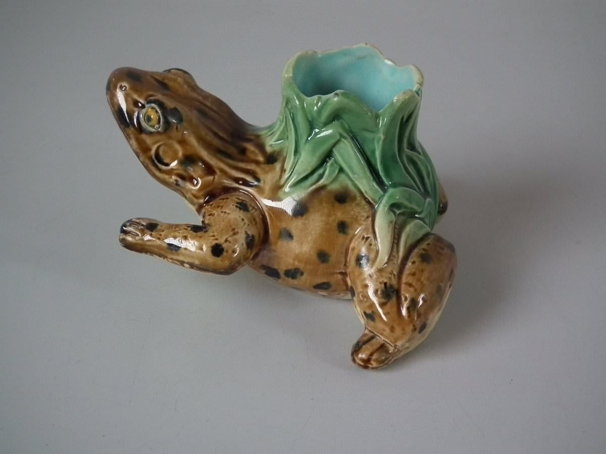 Holdcroft Majolica toothpick holder which features a frog. Coloration: Brown, black, green, are predominant.