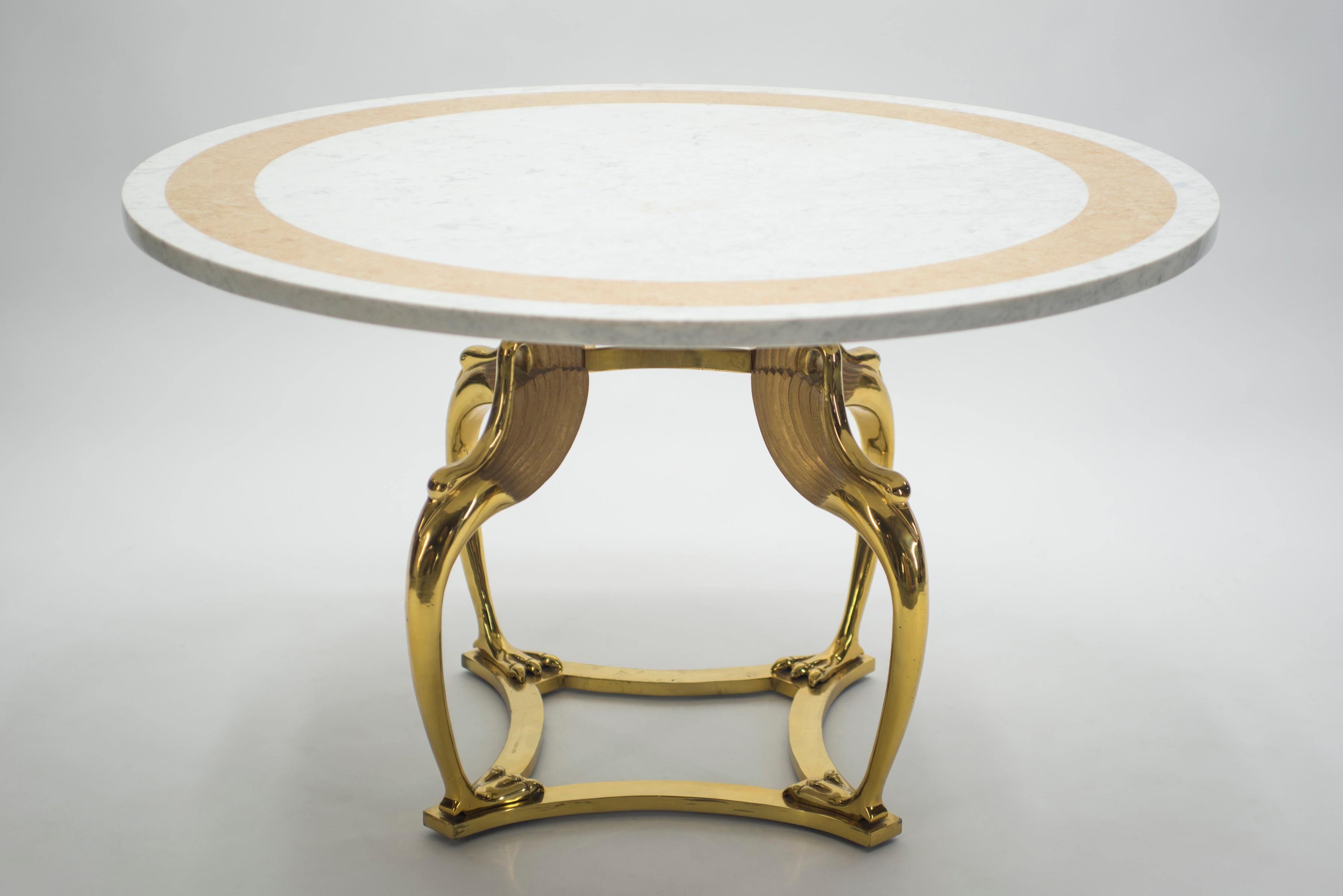 Prominent Hollywood Regency designer Robert Thibier seems to have kept some of his most masterful work for himself: This unique dining table, made from solid brass and white marble, was his personal creation, designed specifically to be used in his