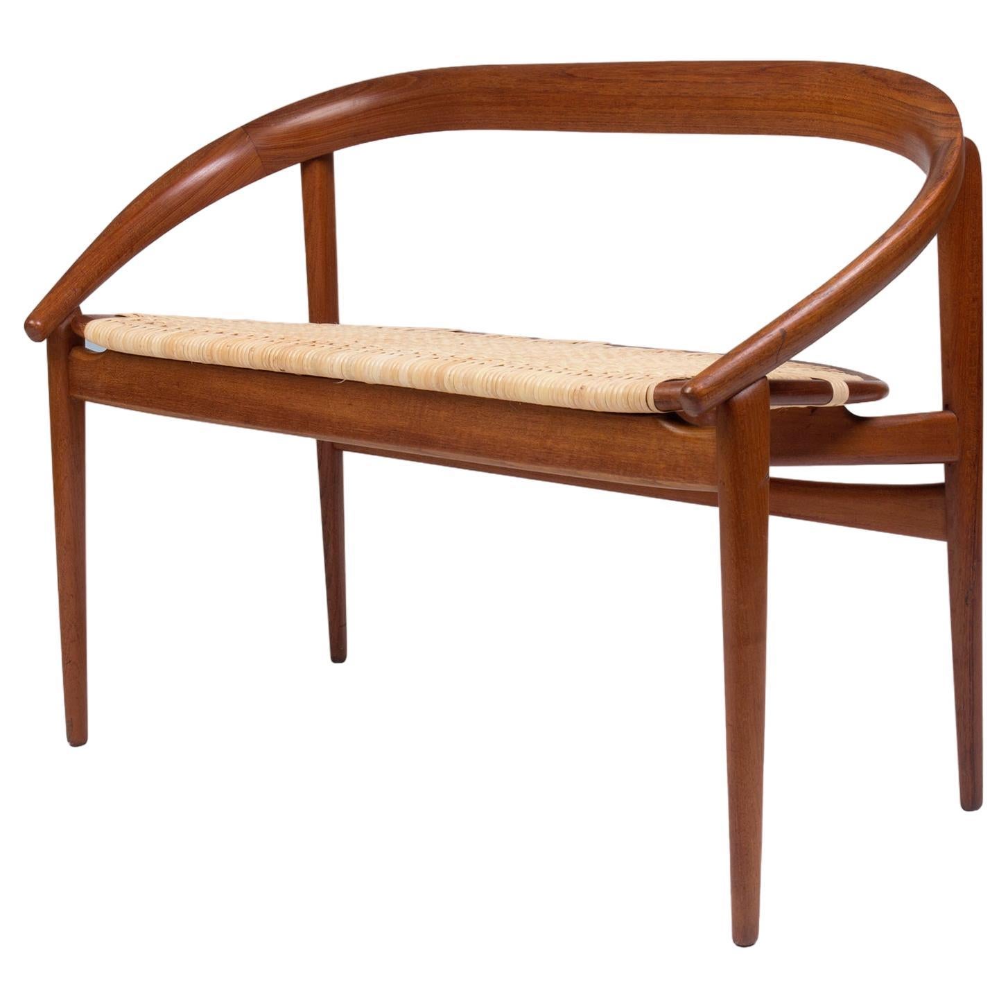Petite Danish modern sofa with horseshoe curved teak and woven light cane seat For Sale