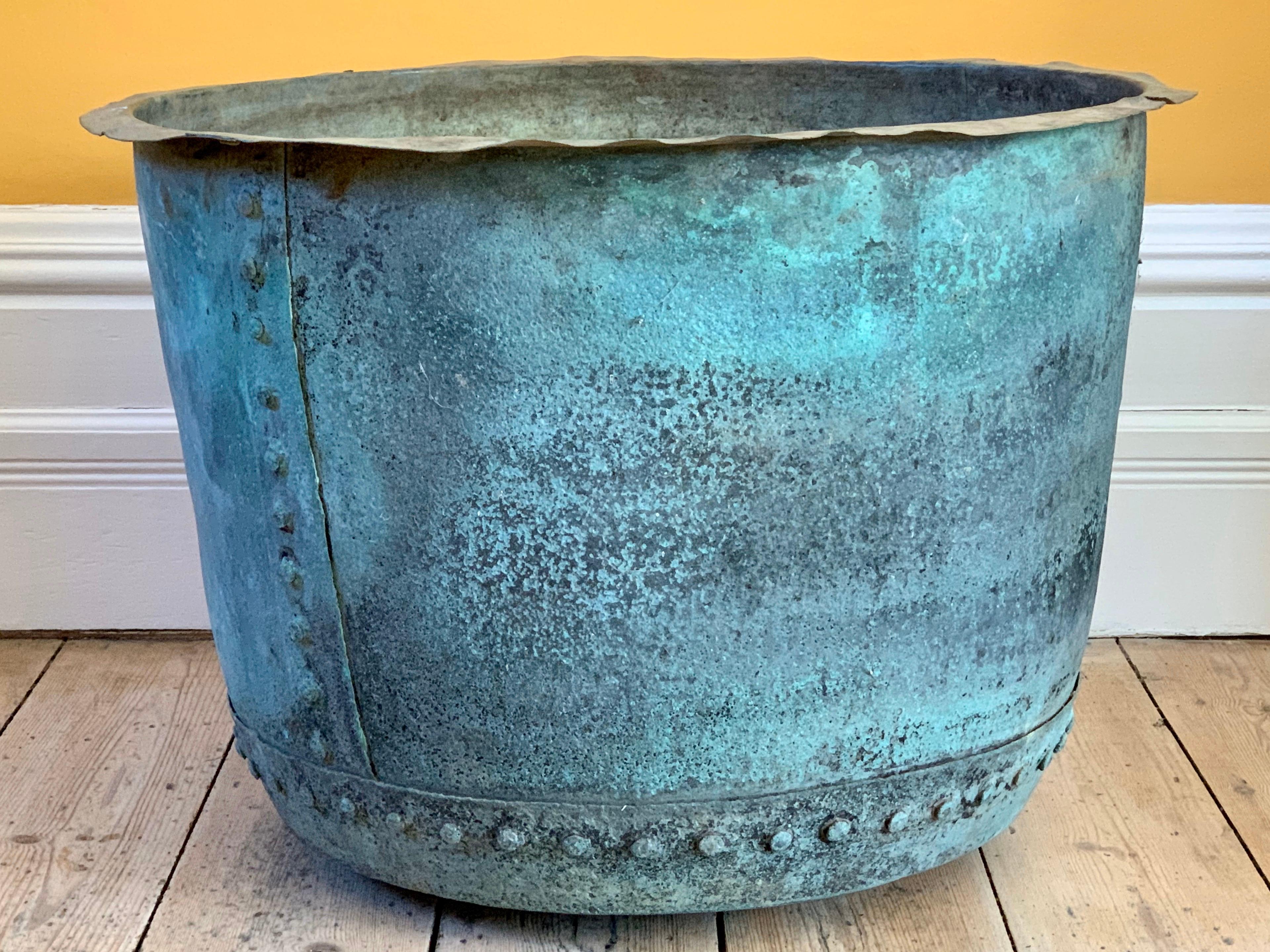 Original riveted copper mid Victorian copper.
Would have been used in a communal wash house to clean clothes. Now looks magnificent as a planter or log bin.

Dog not included!