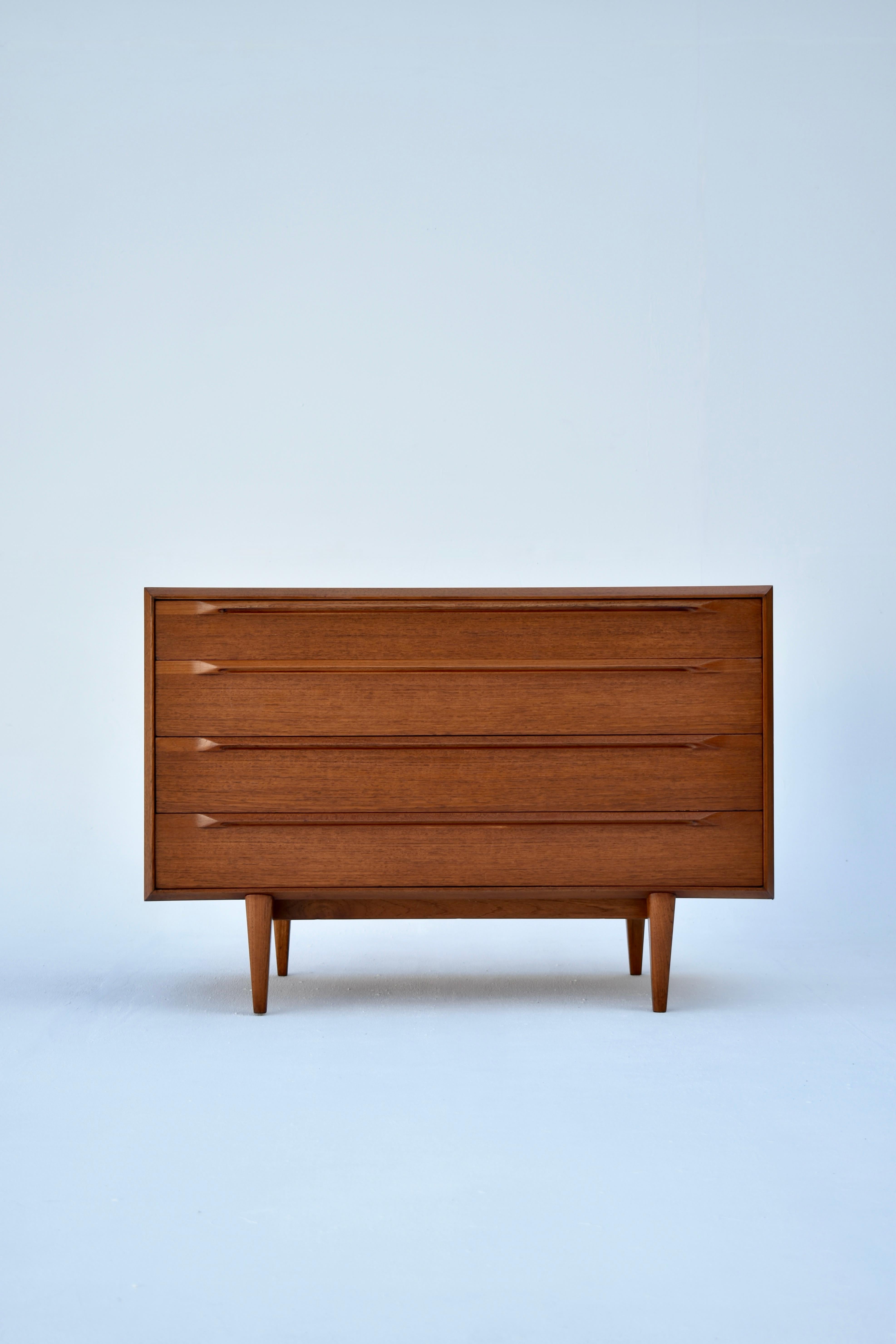 An exceptionally rare design by Ib Kofod Larsen for Fredericia Mobelfabrik. This is the first time we have seen this design in nearly 15 years of collecting Danish Modern.

There are some very unusual and distinctive features to this design such