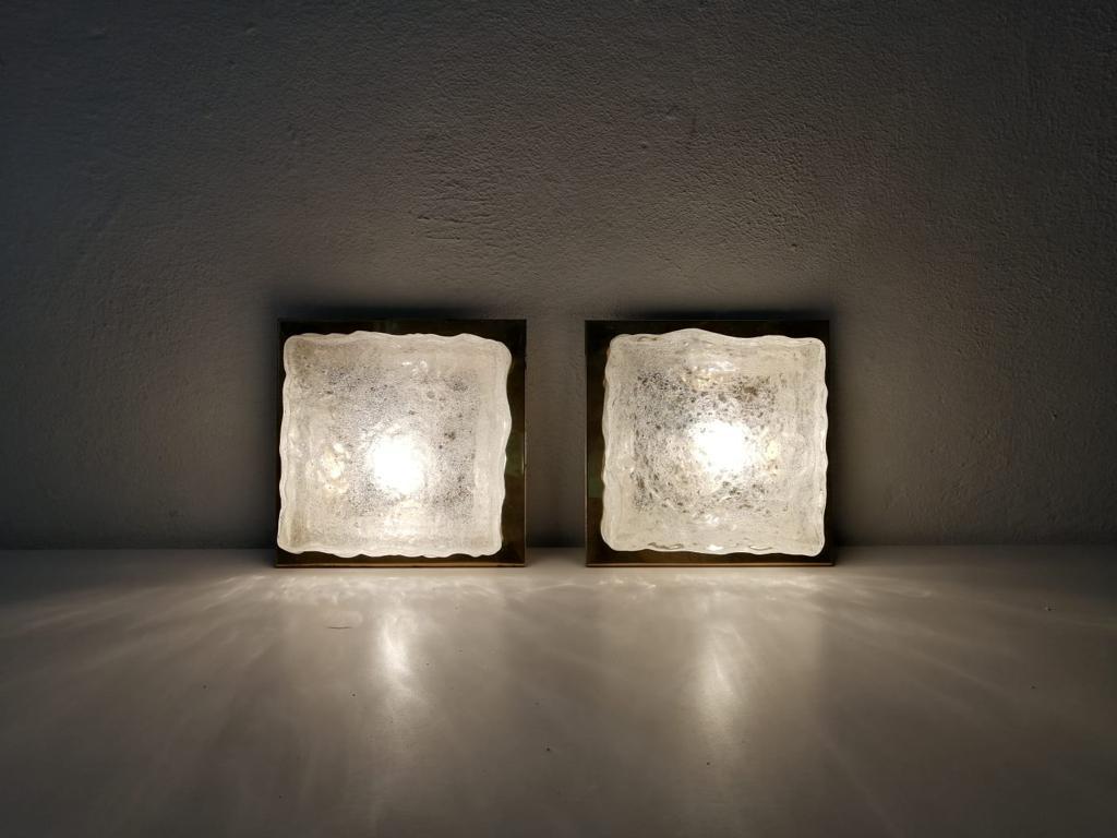 Rare ice glass and brass square form pair of sconces by Hillebrand, 1960s, Germany.

Very elegant and rare wall lamps or ceiling lamps.

Lamps are in very good condition.
These lamps works with E14 standard light bulbs.
Wired and suitable to