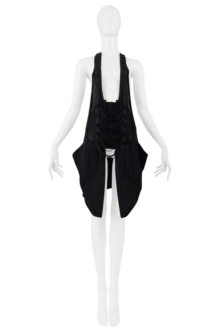 Resurrection is pleased to offer this vintage Balenciaga by Nicolas Ghesquiere iconic halter corset vest top featuring a deep U-neckline, layered cording with looped details at center front, pleated hip pockets with hook panels, and racerback.