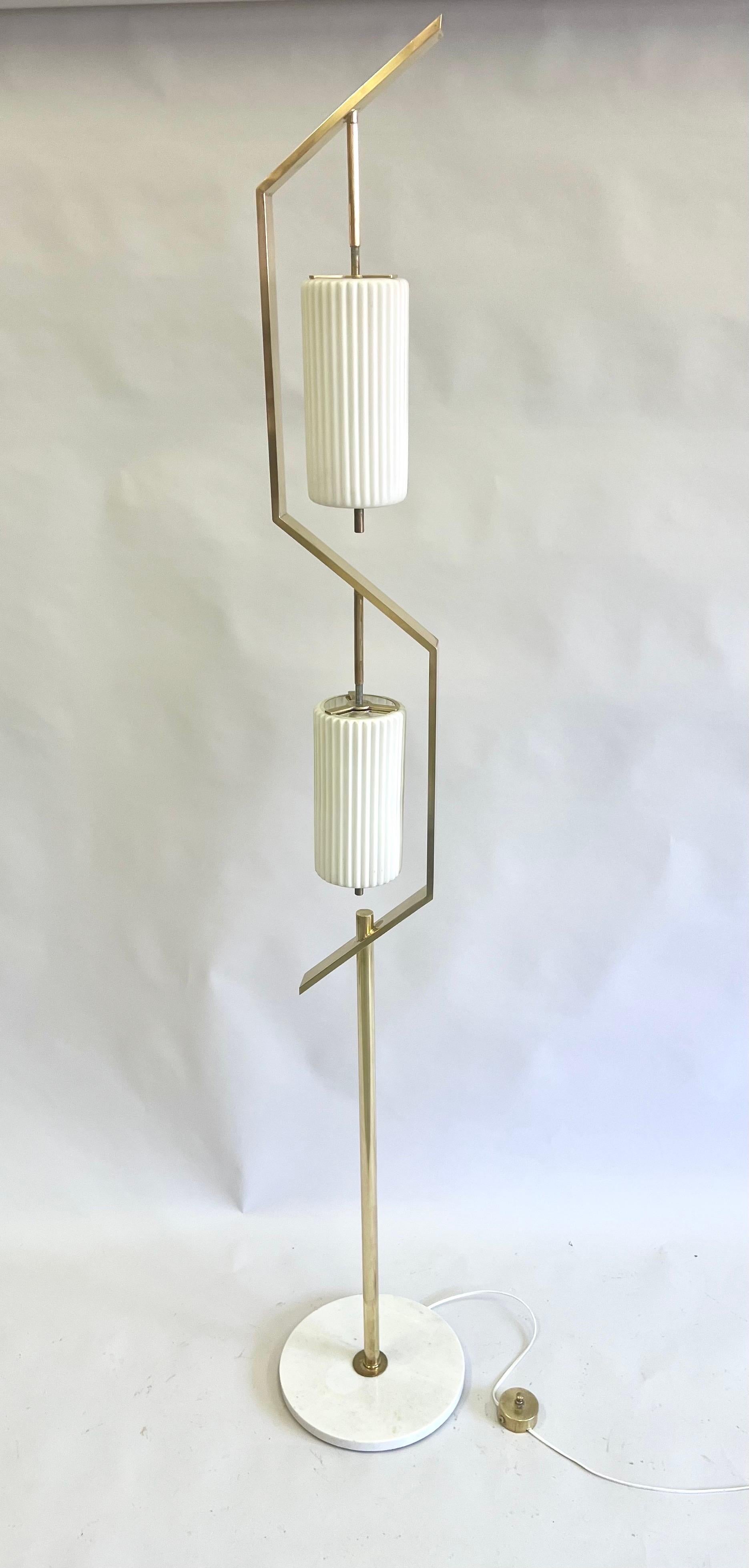 A Rare and Iconic Italian Midcentury Modern Floor Lamp by Angelo Lelli for Arredoluce, Italy, circa 1959. This standing lamp (Cat. #256) is a master work of sculpture and materials. The modern angular brass stem is in counter-balance to itself. This