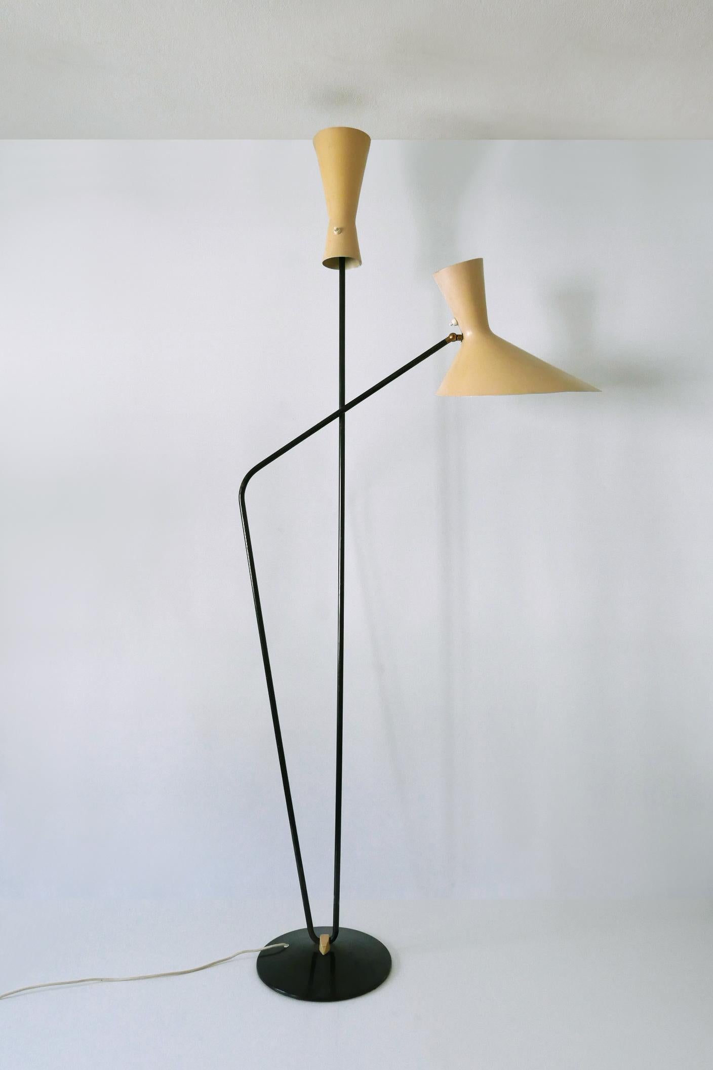 Extremely rare and  iconic floor lamp or reading light. One of the shade adjustable. Designed by Prof. Carl Moor for BAG Turgi, Switzerland, 1950s.

Executed in metal and aluminium, the lamp needs 2 x E27 / E26 Edison screw fit bulbs, is wired, and