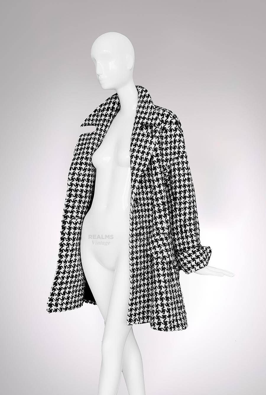 Archival Thierry Mugler Piece, FW1995 Collection.

Extremely rare Thierry Mugler Star-Houndstooth Coat.
Wearable Art. 
Legendary Thierry Mugler created his very own version of the classic houndstooth pattern by turning the iconic Mugler Star into a