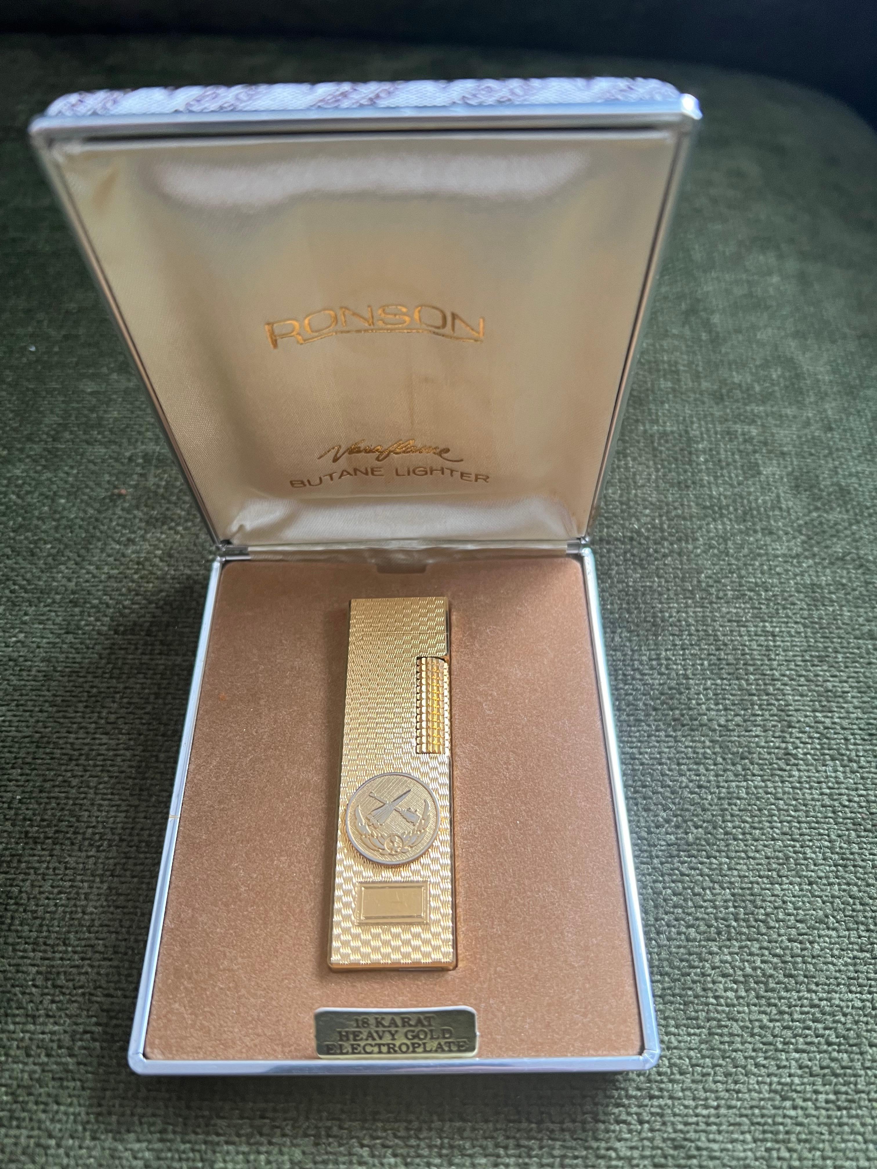 Rare Iconic Vintage and Special Edition Elegant Ronson 18K Gold Plated Lighter 
Circa 1980s 
Swiss Made Lighter
18K heavy gold electroplate Gold 
In mint condition.
Works perfectly. 
Iconic and beautifully engineered piece in rare condition.
In