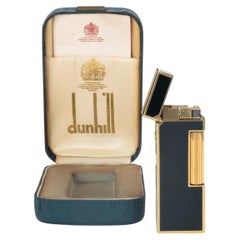 Raro encendedor vintage icónico Dunhill chapado en oro y lacado en negro de fabricación suiza