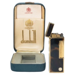 Rare et emblématique briquet Dunhill vintage en laque cognac foncé plaqué or de fabrication suisse