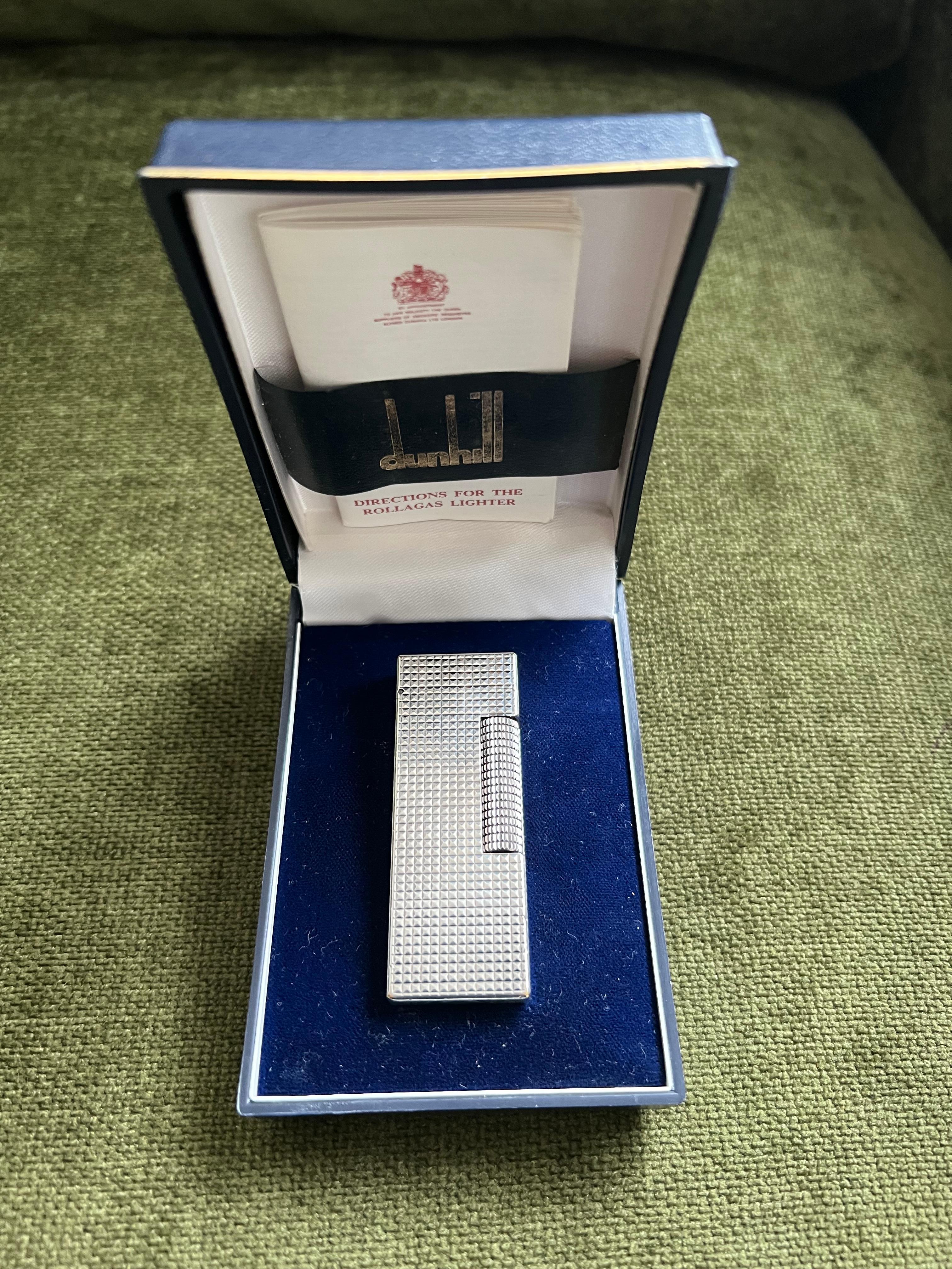Rare Iconic Vintage and Elegant Dunhill silver Plated Swiss Made Lighter
In mint condition. 
Circa 1970
Works perfectly.
Iconic and beautifully engineered piece in rare condition.
 In original Blue box which is in mint condition.  Also includes