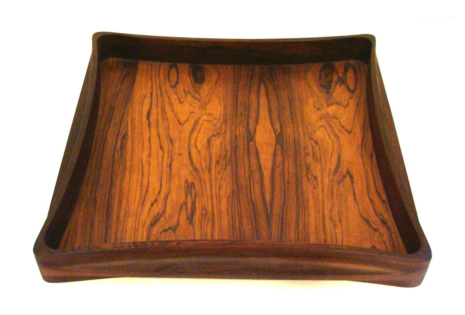 Vintage Jens Quistgaard design. Sculpted or molded structure in Brazilian rosewood. Possibly a unique design in superb original condition. Incised
Dansk/Denmark/IHQ on underside of tray.

Provenance: From estate of Lou Dorfsman, former head of