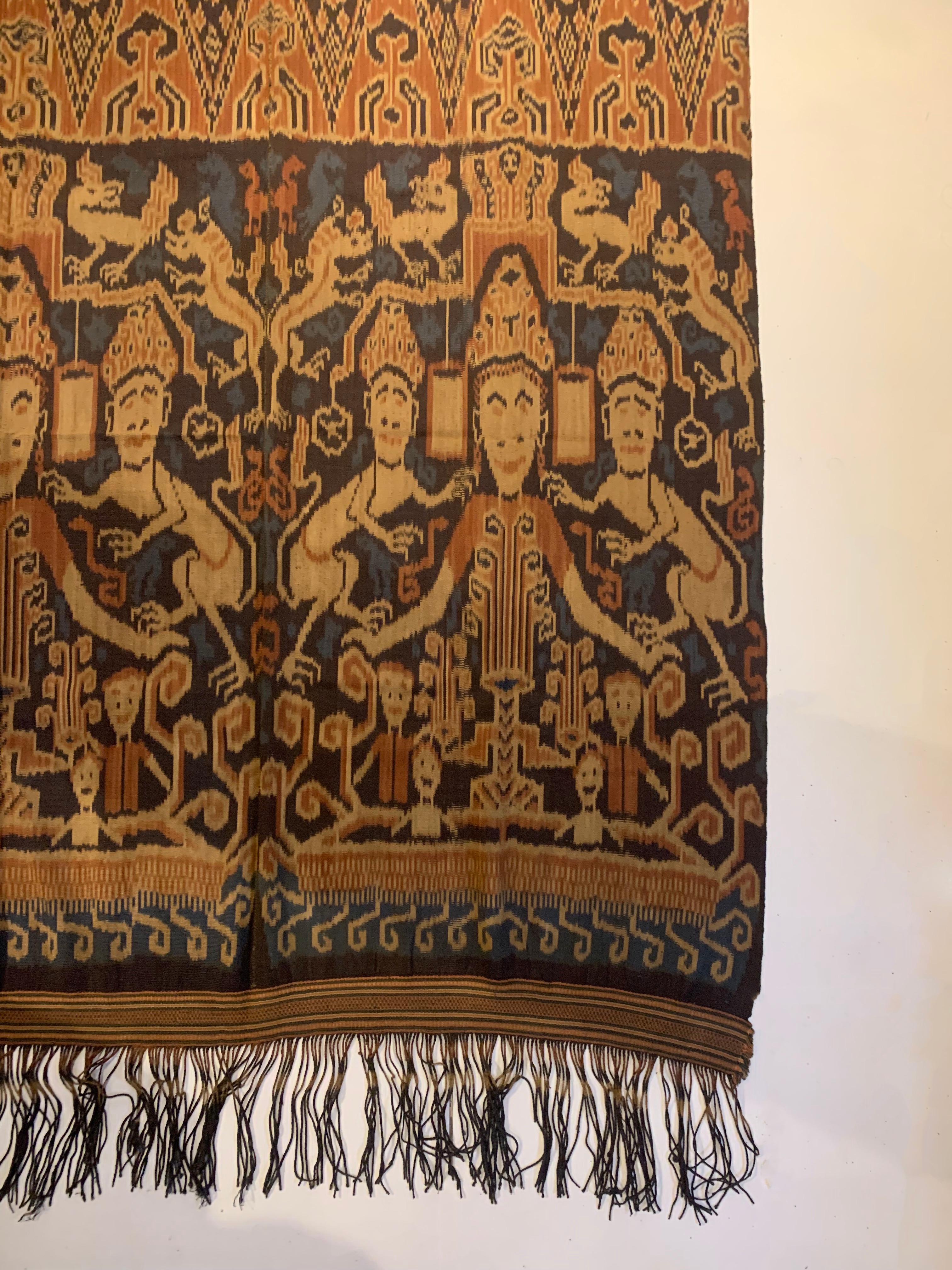This Ikat textile originates from the Island of Sumba, Indonesia. It is hand-woven using naturally dyed yarns via a method passed on through generations. It features a stunning array of distinct tribal patterns and motifs. Chickens are a common