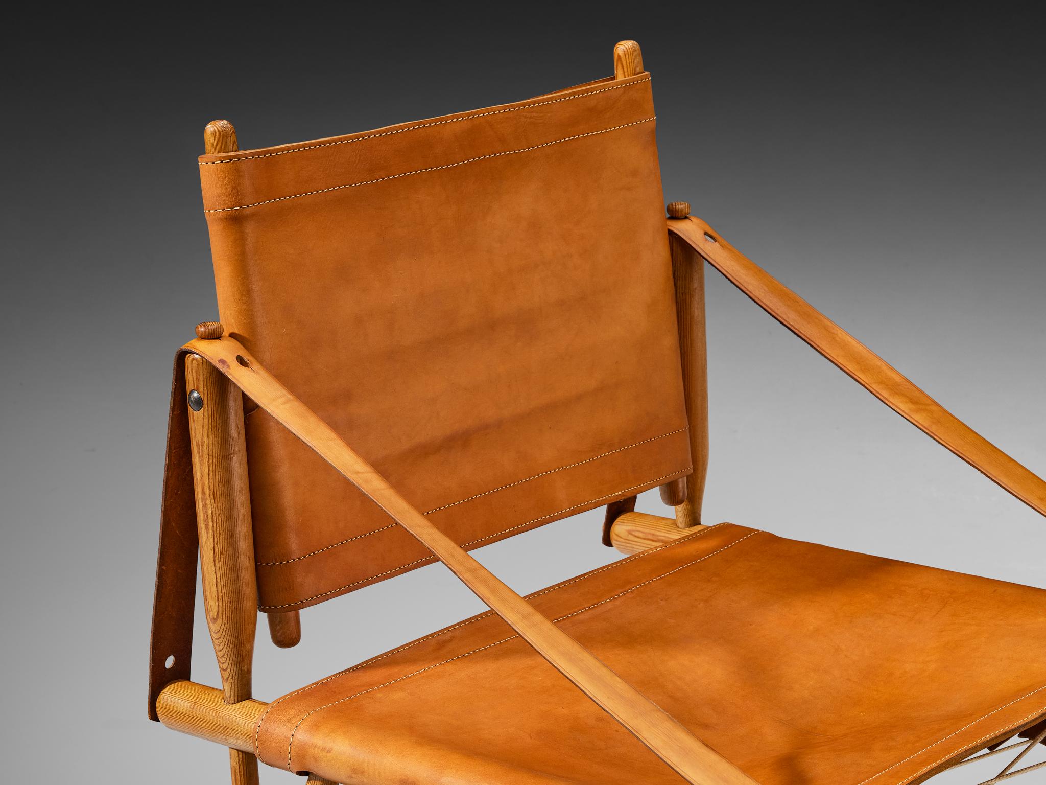 Ilmari Tapiovaara for Lukkiseppo, 'Chaco' armchair, leather, pine, brass, rope, Finland, design 1958, made 1959 

We present an exquisite lounge chairs known as 'Chaco', meticulously designed by the eminent Finnish designer Ilmari Tapiovaara. This