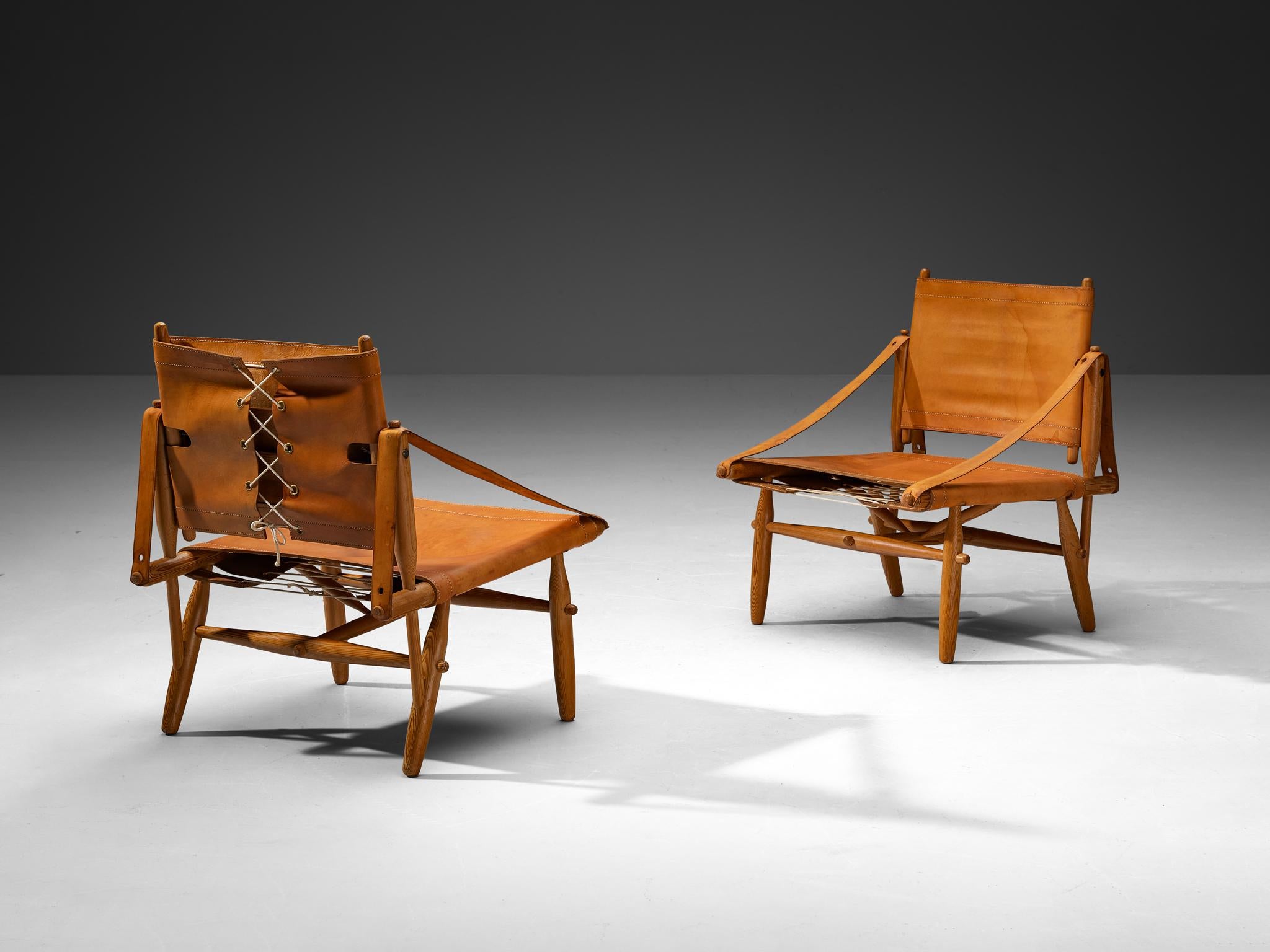 Ilmari Tapiovaara for Lukkiseppo, 'Chaco' armchairs with coffee table, leather, pine, brass, rope, Finland, design 1958

We present these exquisite lounge chairs known as the Chaco collection, meticulously designed by the eminent Finnish designer