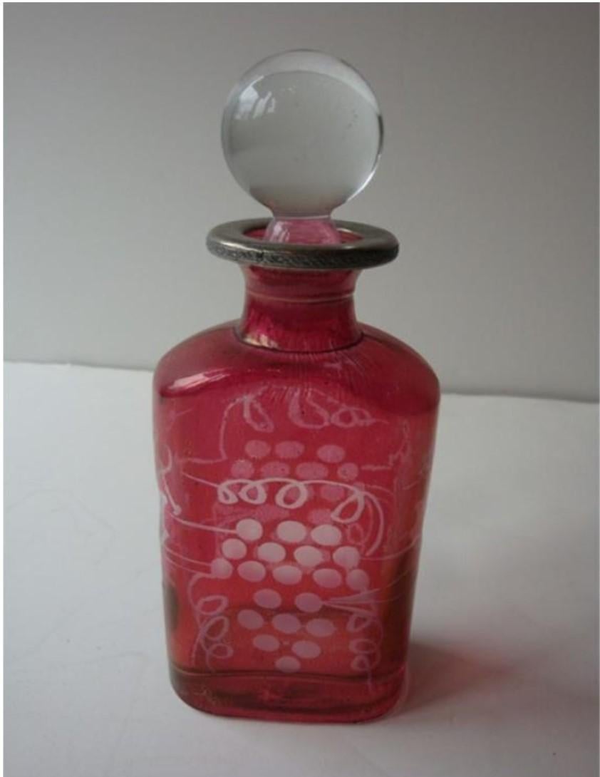 The Following Item we are offering is a Rare French Cranberry Etched Glass Perfume / Liquor Bottle. Bottle is Etched with Clusters of Grapes and Beautiful Glass Ball Top. Beautifully done with Exquisite Detail. From a Rare New York City Estate