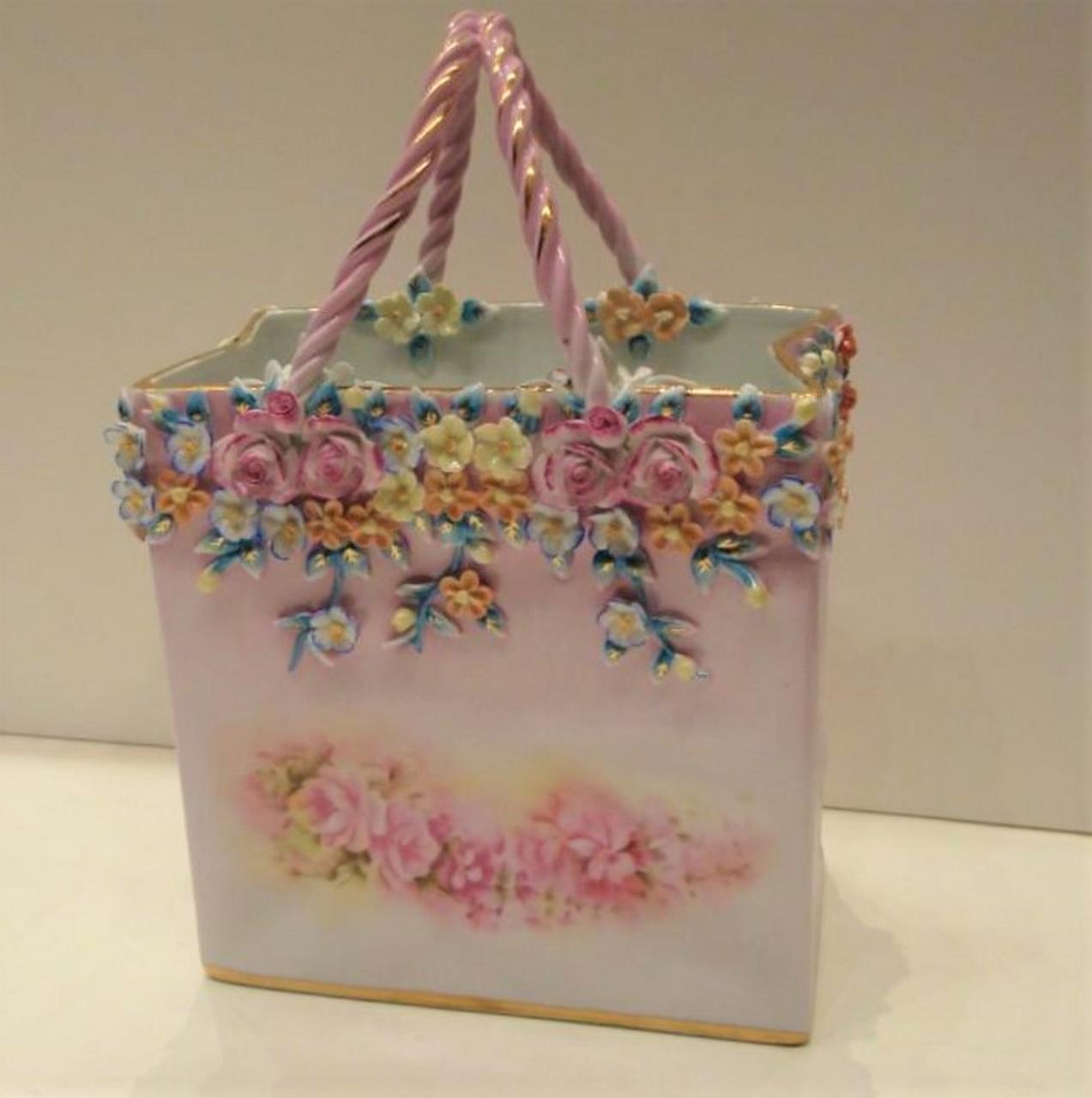 The following Item we are offering is a Spectacular Handpainted Sevres Style / Dresden Style Porcelain Shopping Bag/ Basket with Intricate Colorful Floral Motifs outside and inside of Basket. Basket is laced with braided intertwined handles. Taken